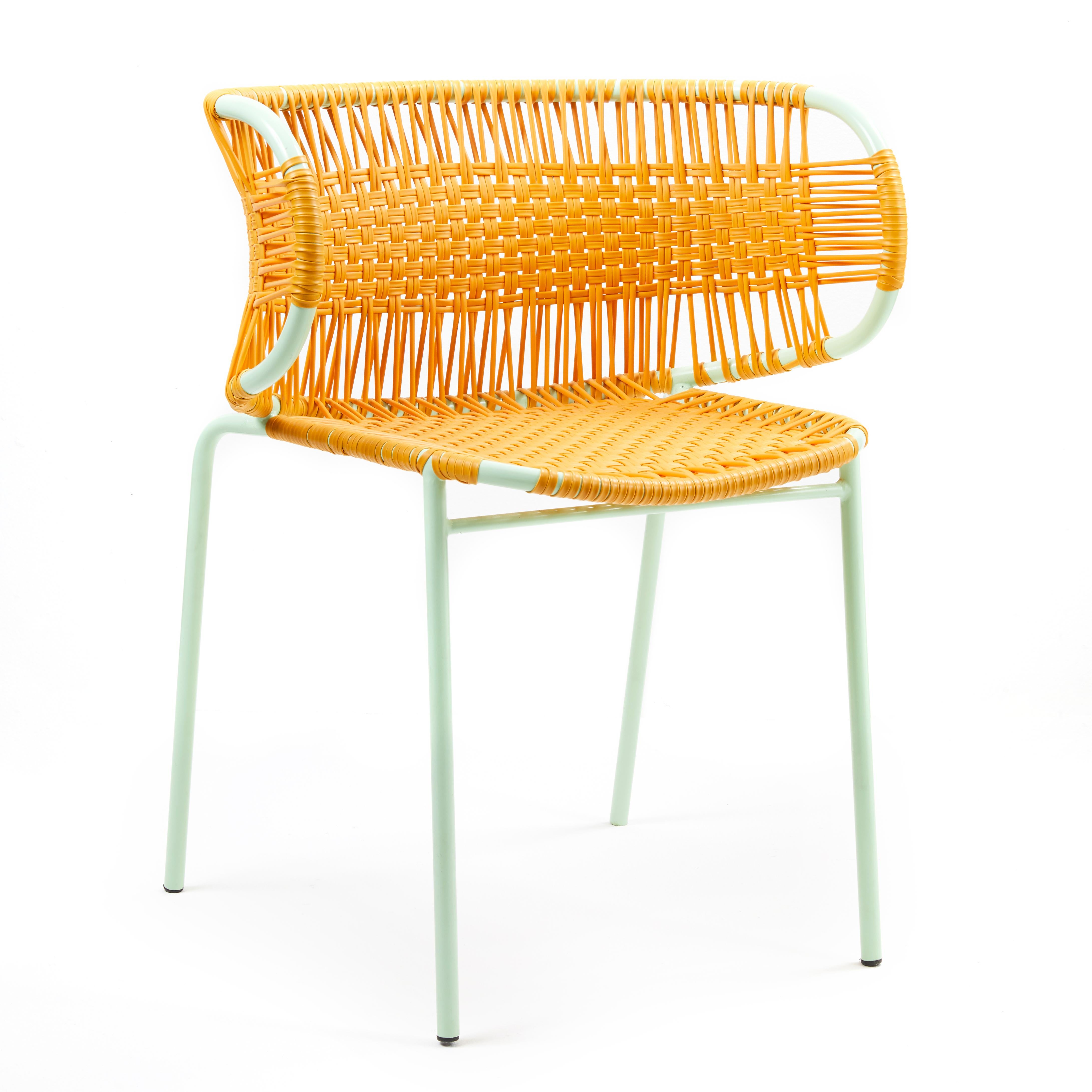Honey Cielo stacking chair with armrest by Sebastian Herkner
Materials: Galvanized and powder-coated tubular steel. PVC strings are made from recycled plastic.
Technique: Made from recycled plastic and weaved by local craftspeople in Cartagena,