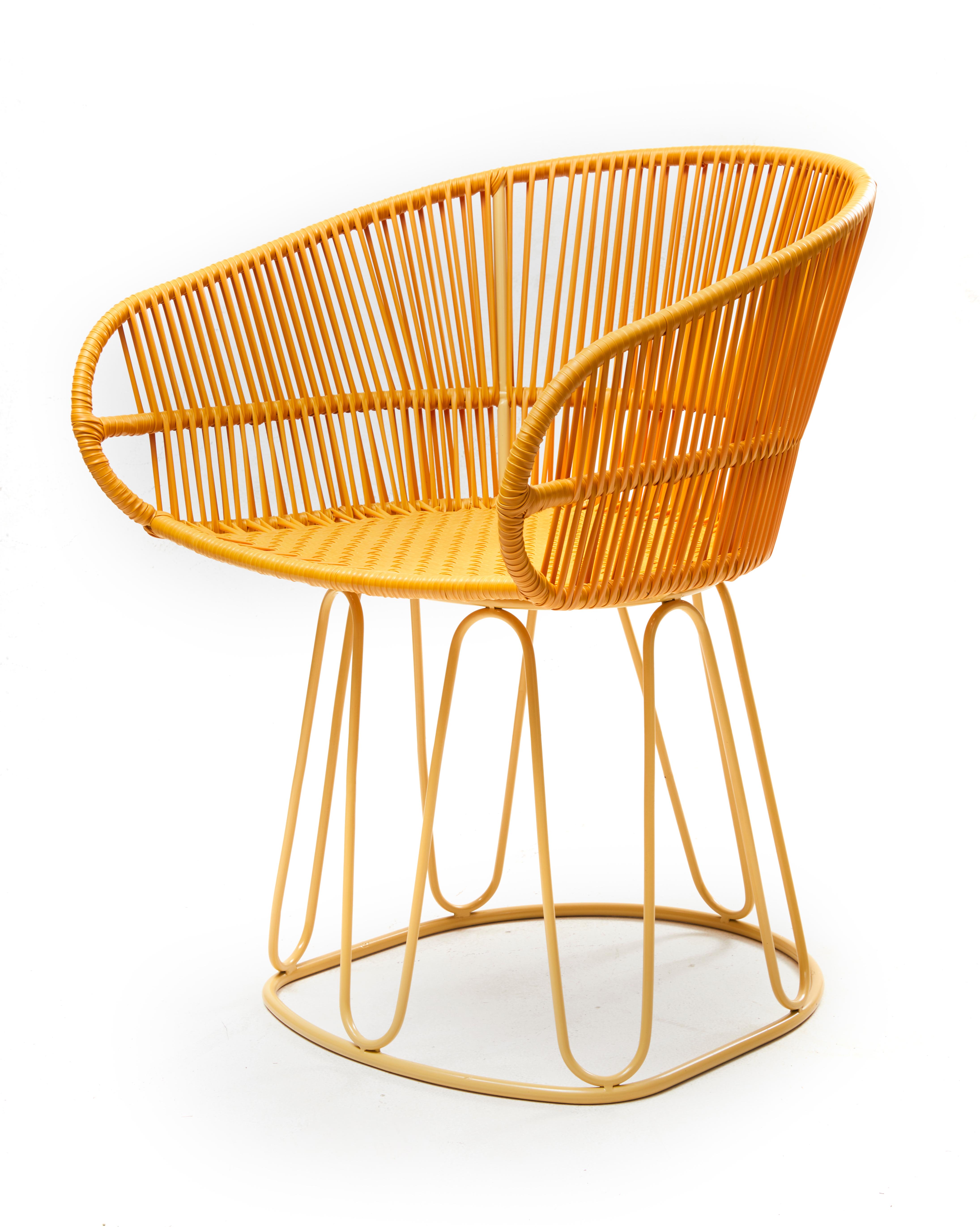 Honey Circo dining chair by Sebastian Herkner
Materials: Galvanized and powder-coated tubular steel. PVC strings.
Technique: Made from recycled plastic. Weaved by local craftspeople in Colombia. 
Dimensions: W 61.5 x D 56.5 x H 77.5 cm