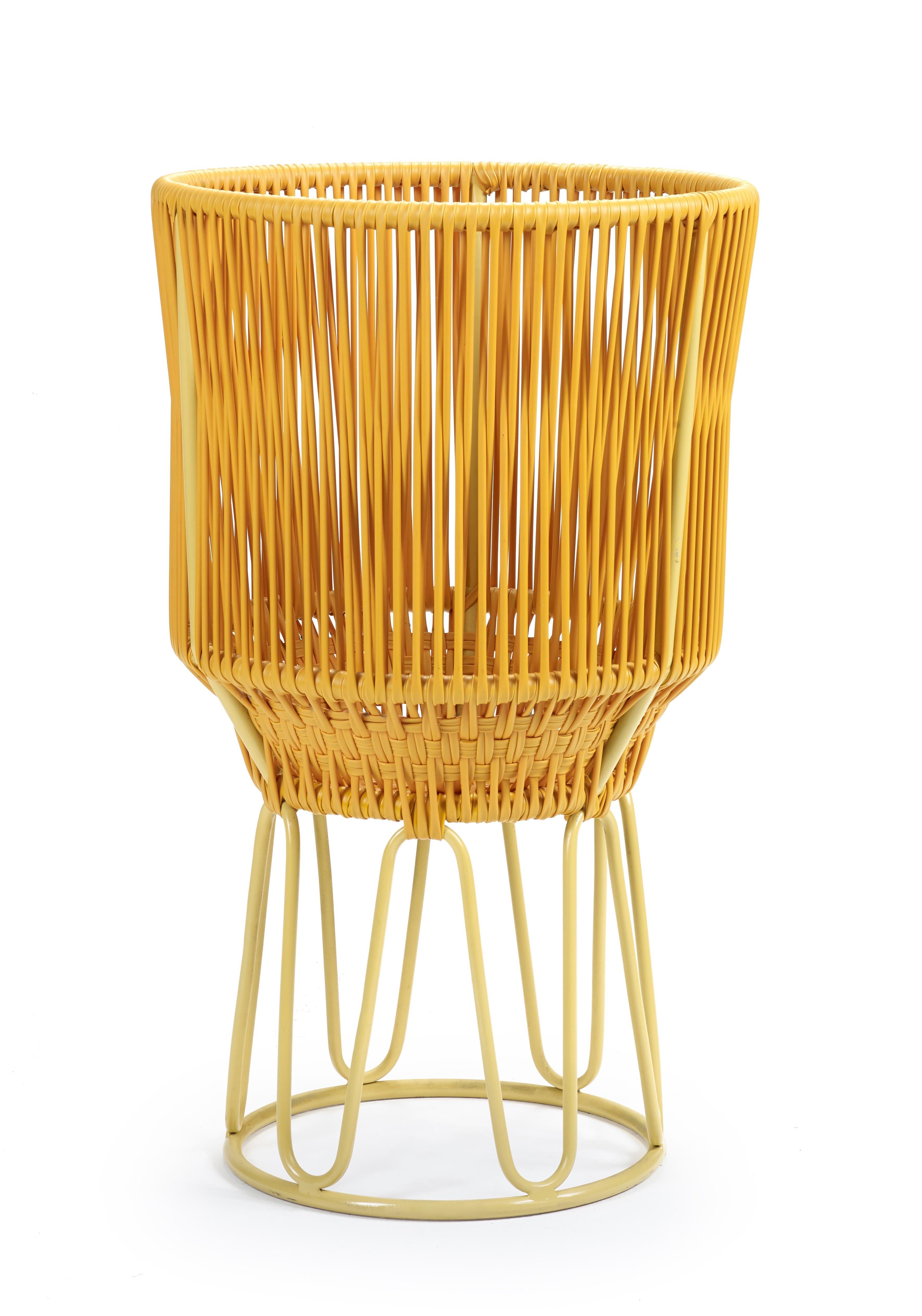 Honey Circo flower pot 2 by Sebastian Herkner
Materials: Galvanized and powder-coated tubular steel. PVC strings.
Technique: Made from recycled plastic. Weaved by local craftspeople in Colombia. 
Dimensions: 
Top Diameter 40 x H 68 cm 
Base