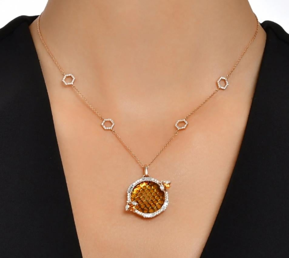Crafted in 14k rose gold and adorned with a 0.22 ct marquise-cut diamond, 0.71 ct white diamond, and 0.27 ct citrine, it merges elegance with profound symbolism.

The bee's honeycomb symbolizes life's beauty and harmony, its hexagonal shape