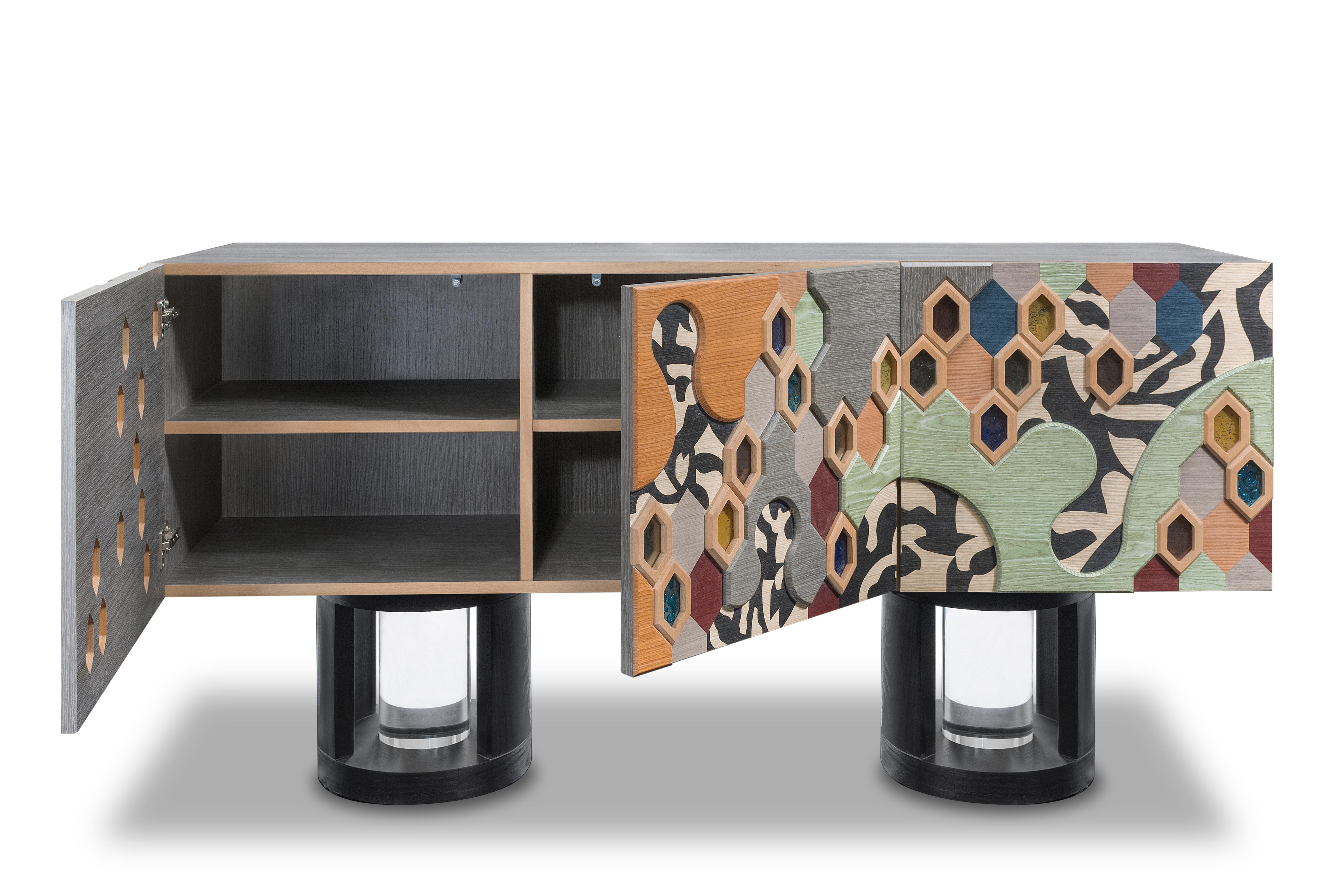 The Honey Comb Sideboard is a stunning and contemporary piece designed to be both functional and visually captivating. The black and white figures symbolize the straight forward connection or interaction between two happy people evolving in the