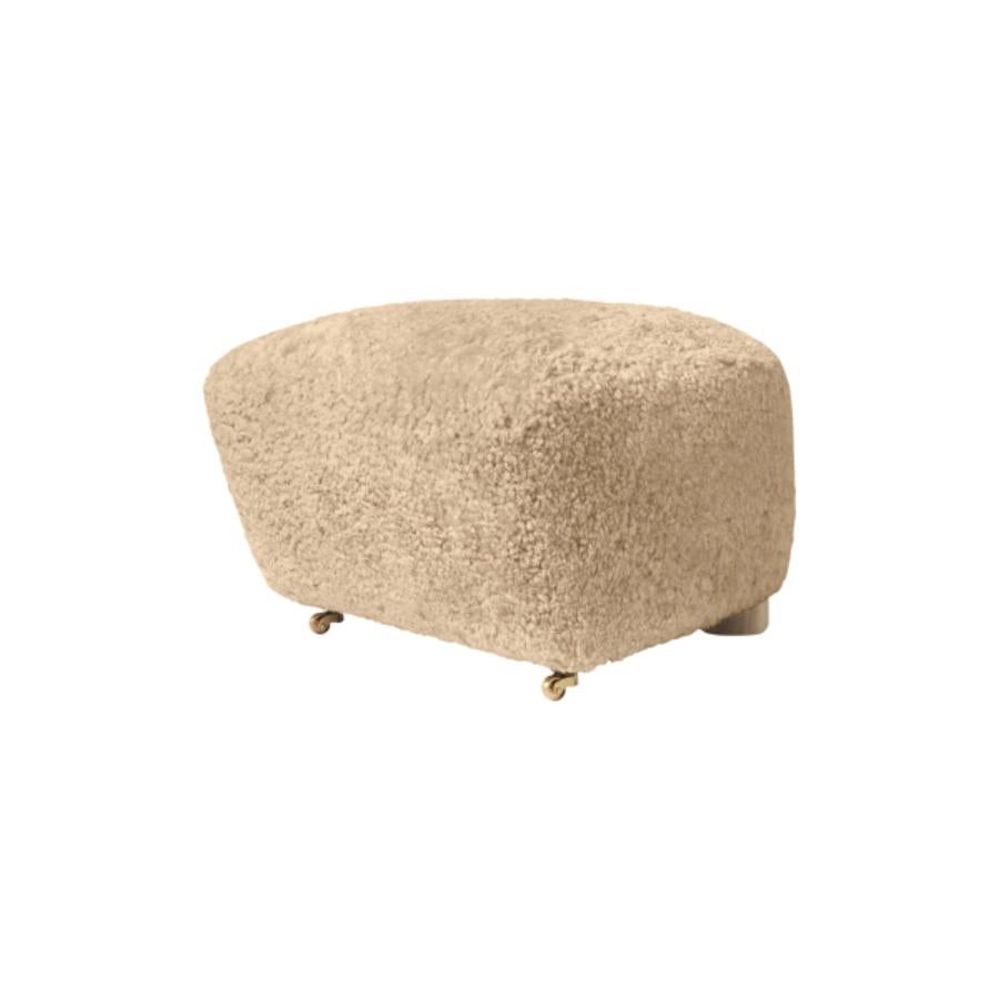 Honey Natural Oak Sheepskin The Tired Man Footstool by Lassen
Dimensions: W 55 x D 53 x H 36 cm 
Materials: Sheepskin

Flemming Lassen designed the overstuffed easy chair, The Tired Man, for The Copenhagen Cabinetmakers’ Guild Competition in