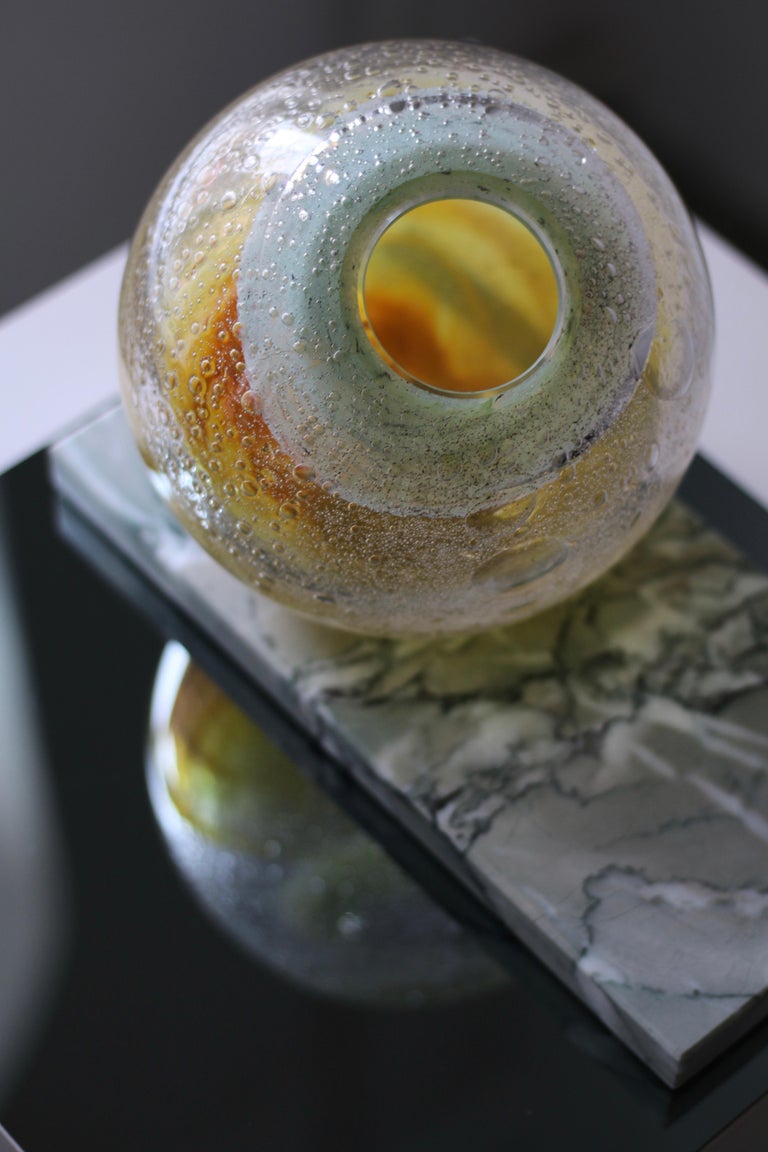 'Honey Orb' contemporary vase in mouth blown glass in warm yellow and mint green on Verde Antigua marble. 

Handcrafted by a team of skilled craftsmen in highest quality, extra clear glass.
Unique item, signed. 

Item is composed of two separate