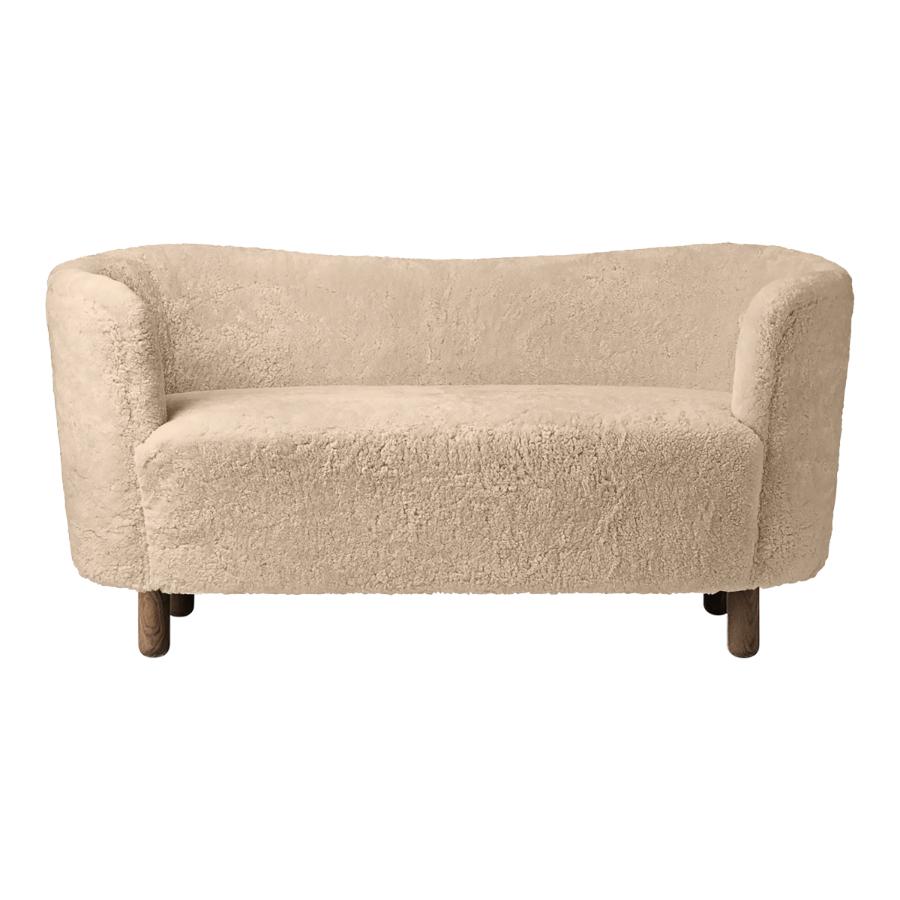 Honey sheepskin and smoked oak mingle sofa by Lassen
Dimensions: W 154 x D 68 x H 74 cm 
Materials: Sheepskin, Oak.

The Mingle sofa was designed in 1935 by architect Flemming Lassen (1902-1984) and was presented at The Copenhagen Cabinetmakers’