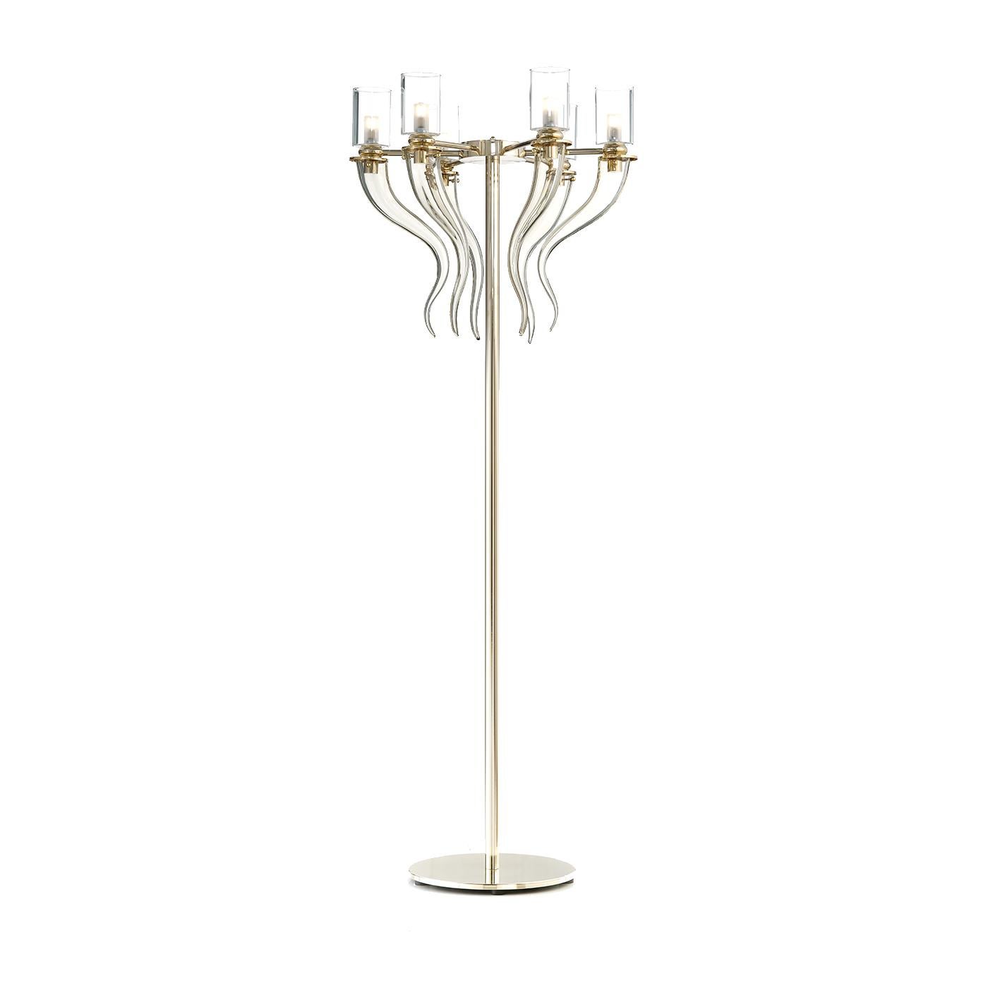 Part of the Honey collection, which includes the Honey Venetian glass table lamp and the Honey Venetian glass chandelier, this floor lamp blends traditional Venetian glass techniques with a modern sensibility for a timeless affect that makes it