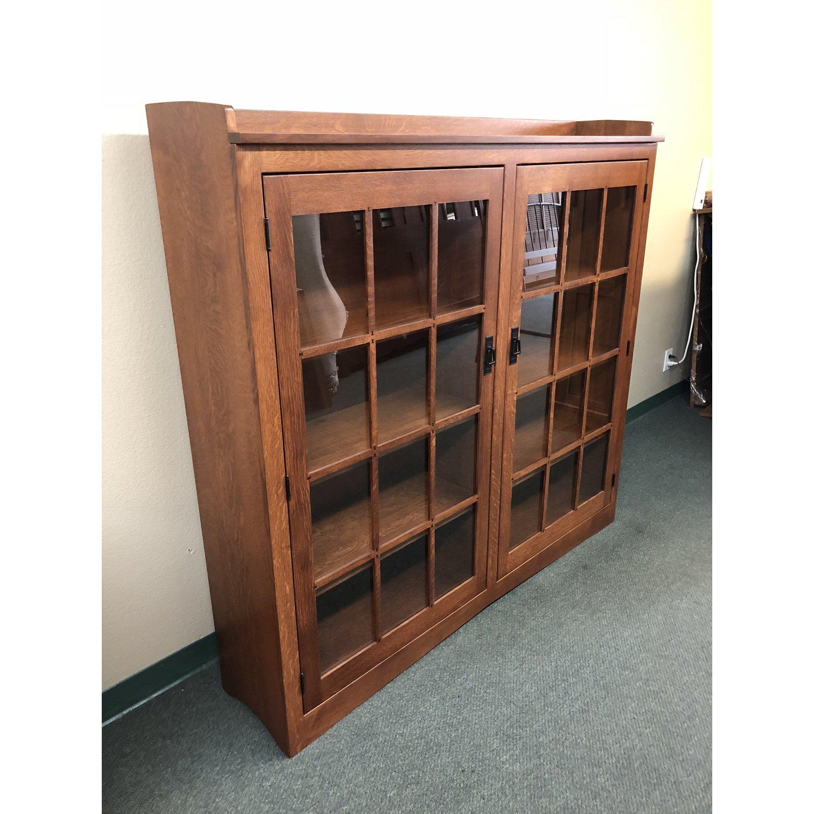 A double door cabinet by Honeybee Furniture, straight from a designer showroom. Built of solid white oak with intricate craftsman details. This lovely cabinet has six adjustable shelves. Made in USA to stand the tests of time.

