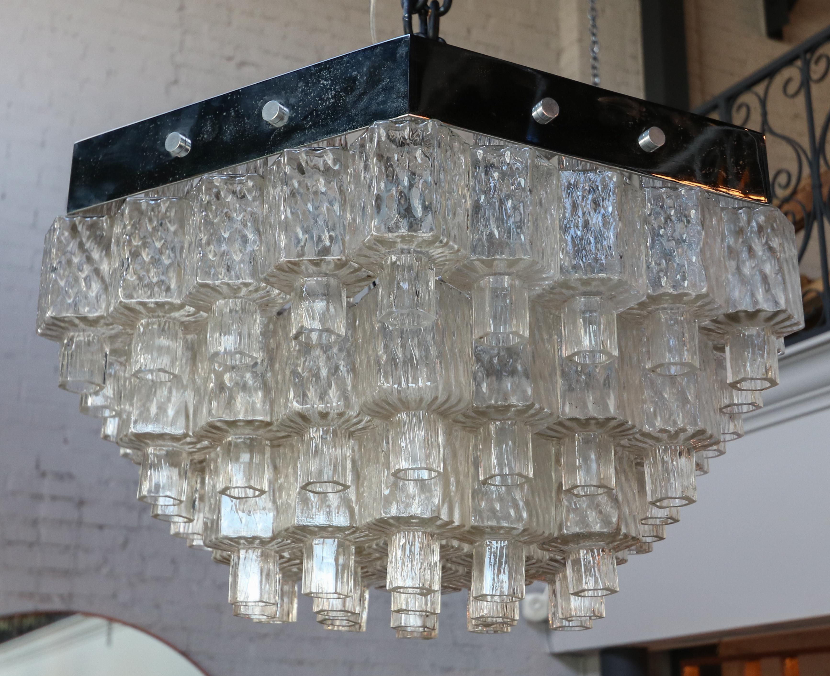 Italian 1960s chandelier in a honeycomb hexagon shape, with hexagon shaped textured clear glass on a chrome frame.