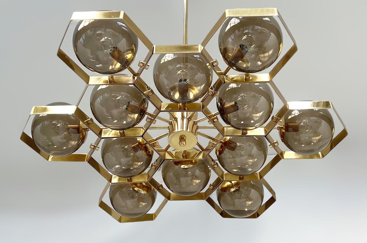 Italian modern chandelier with Murano glass globes, mounted on lacquered polished brass frame / Made in Italy Designed by Fabio Ltd, inspired by Angelo Lelli and Arredoluce styles
12 lights / E12 or E14 type / max 40W each
Diameter: 36 inches /