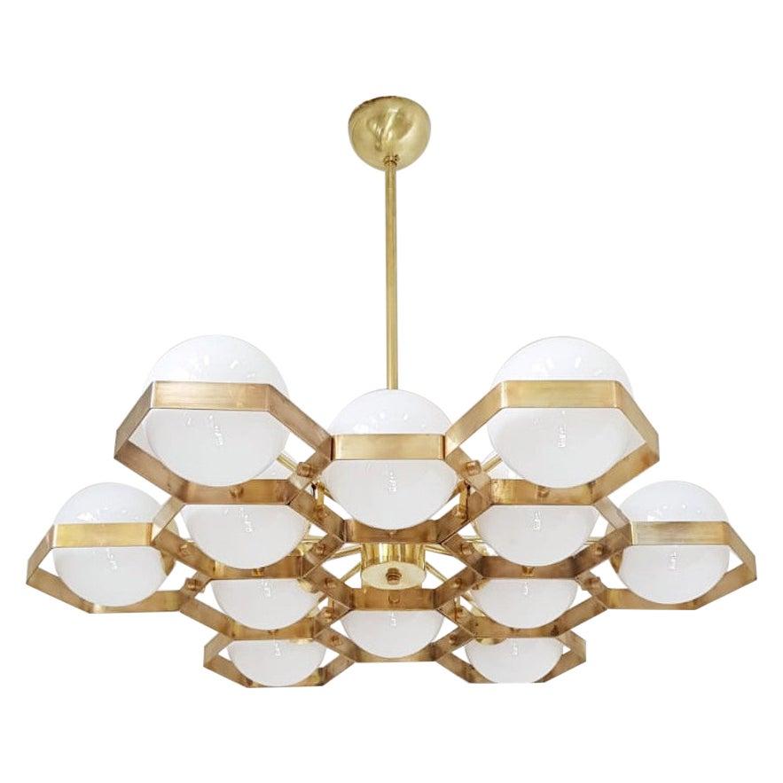 Italian modern chandelier with Murano glass globes, mounted on unlacquered brass frame / Made in Italy Designed by Fabio Ltd, inspired by Angelo Lelli and Arredoluce styles
12 lights / E12 or E14 type / max 40W each
Diameter: 36 inches / Height: 30