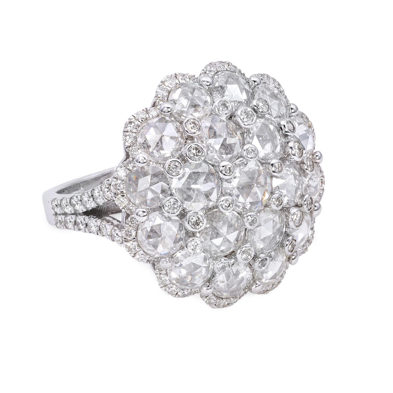 This stunning ring boasts of a remarkable combination of rose-cut diamonds weighing 2.23 carats and round-cut diamonds weighing 0.61 carats, set in 18K white gold. The bigger rose-cut diamonds allow for a more unique and multidimensional sparkle,