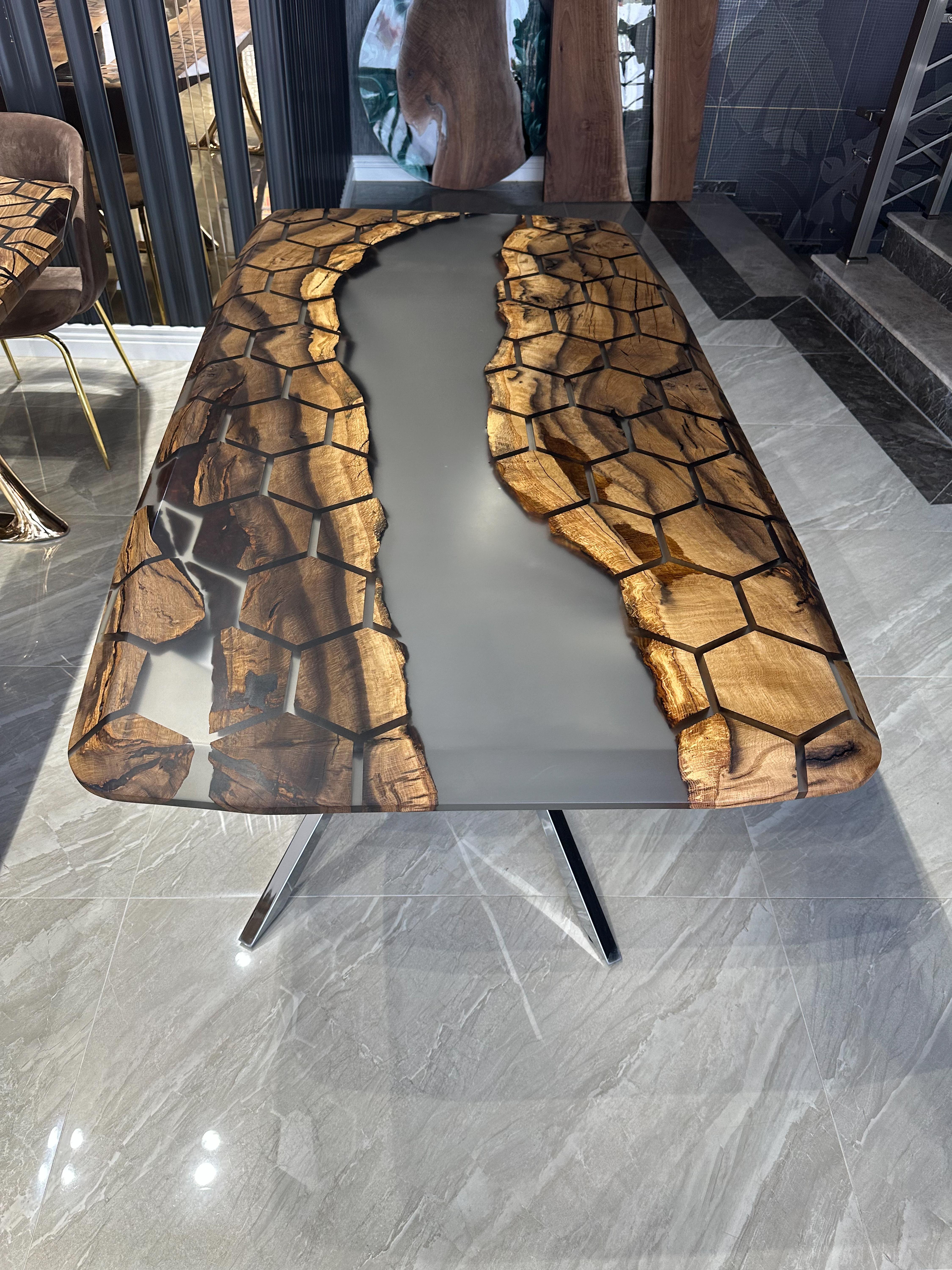 HEXAGON GRAY EPOXY RESIN DINING TABLE 

This epoxy table emerges as a unique work of art, inspired by nature's beauty. With its honeycomb pattern and hexagonal shapes, it offers an aesthetic delight. 

Our narrative embodies the magnificent order