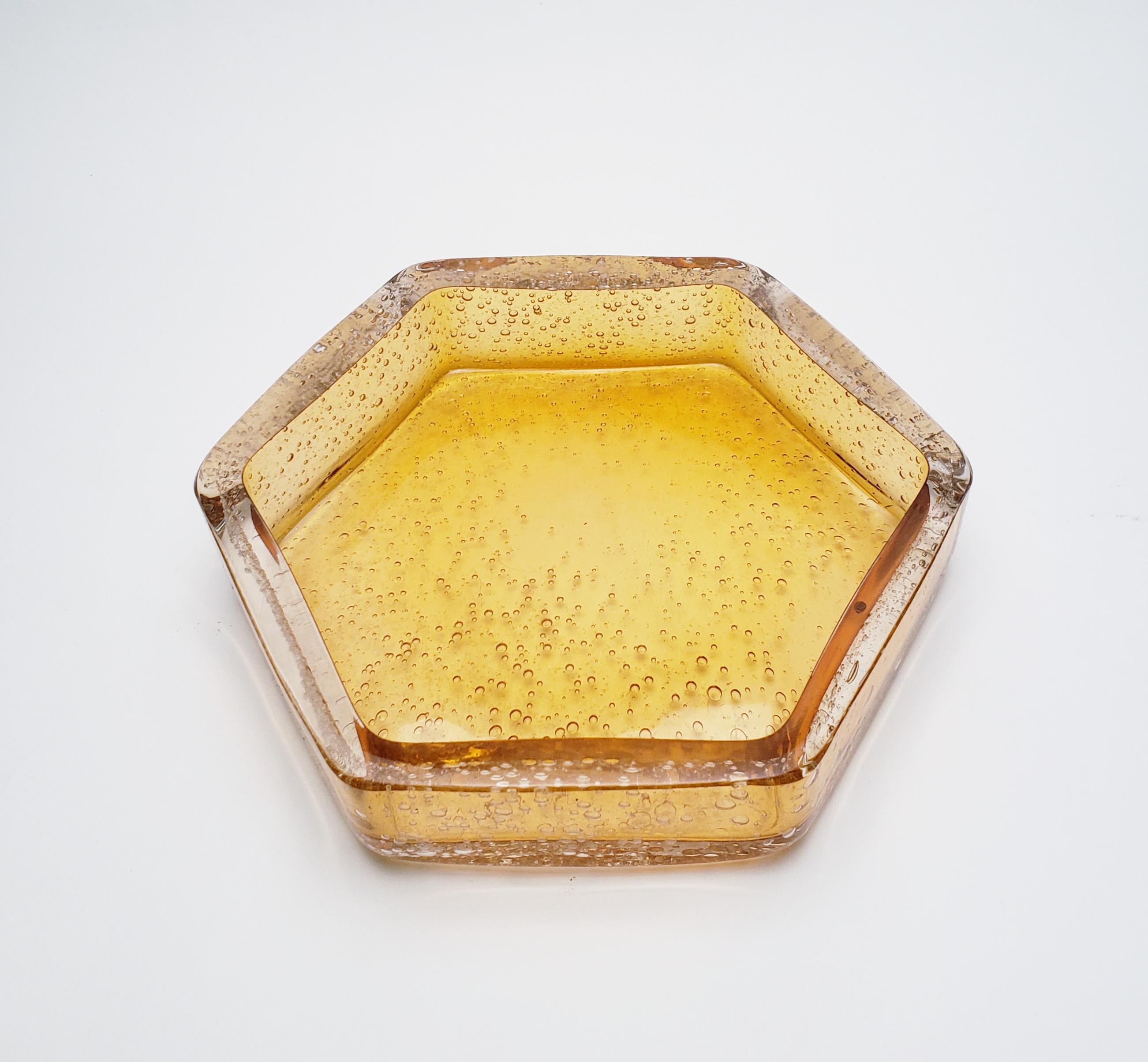 The honeycomb desk set is comprised of four separate organizing containers that create a contemporary look on any desk environment. Made with gold topaz color, the set includes a large catch all (2.5