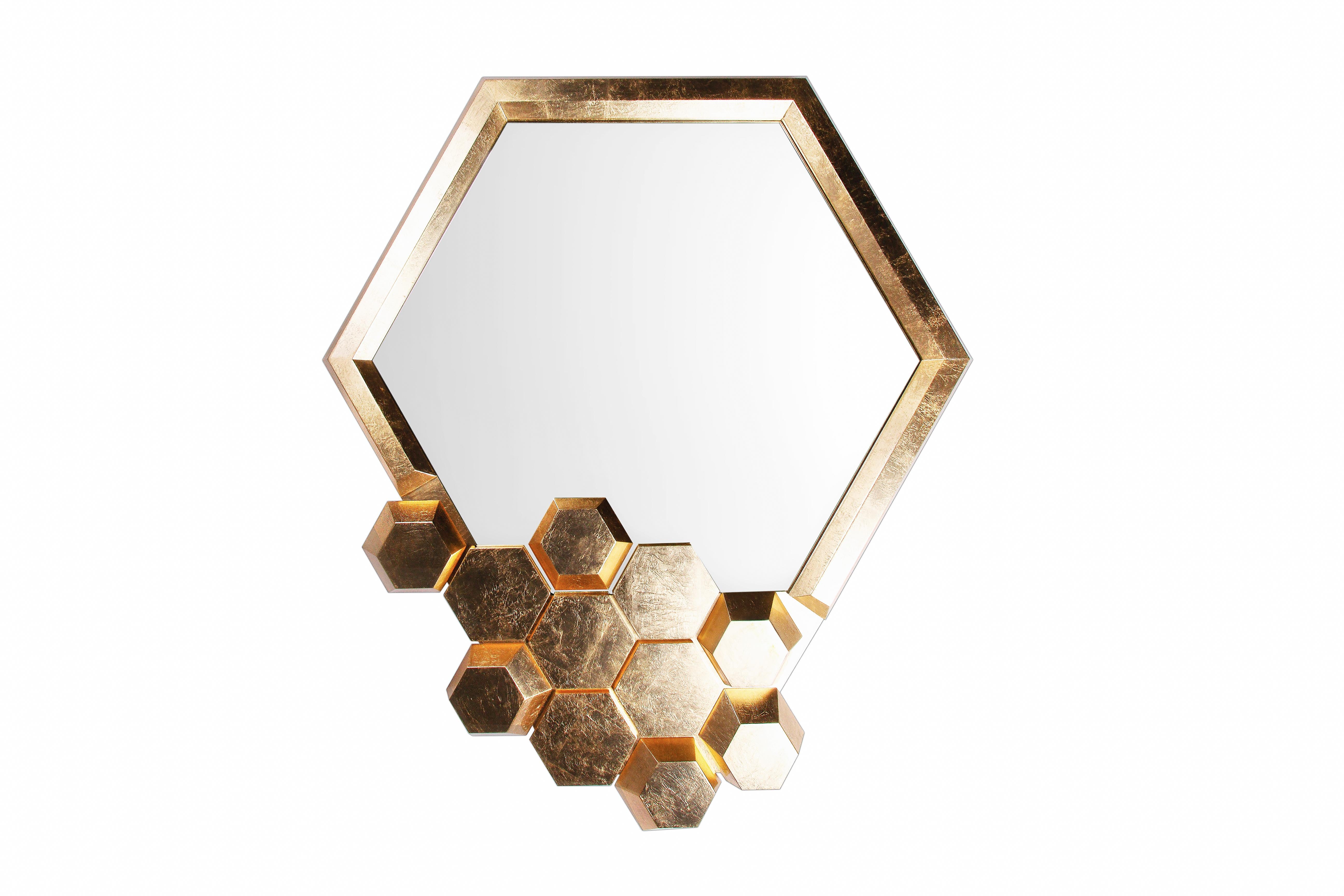 Honeycomb Limited Edition wall mirror, Royal Stranger
Dimensions: 177 x 7 x 152 cm
Materials: Polished brass structure standing on the top of a Carrara marble

Like a honey filled hive on a busy spring day, the limited-edition honeycomb mirror