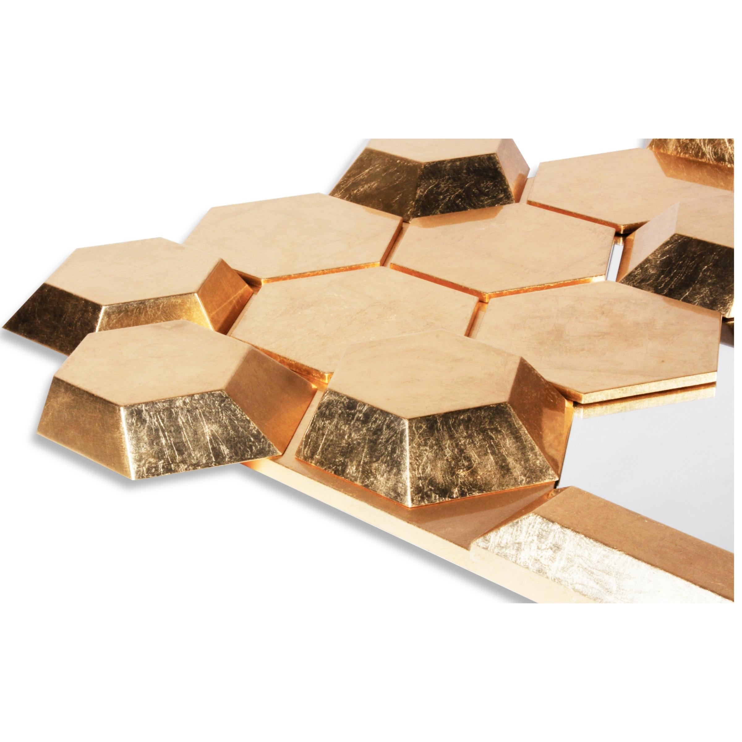 Like a honey filled hive on a busy spring day, the limited-edition Honeycomb Mirror is covered in gold leaf and conveys a luminous reflection boosting its luxurious and exuberant personality.
The oversized scale and unique design make it the