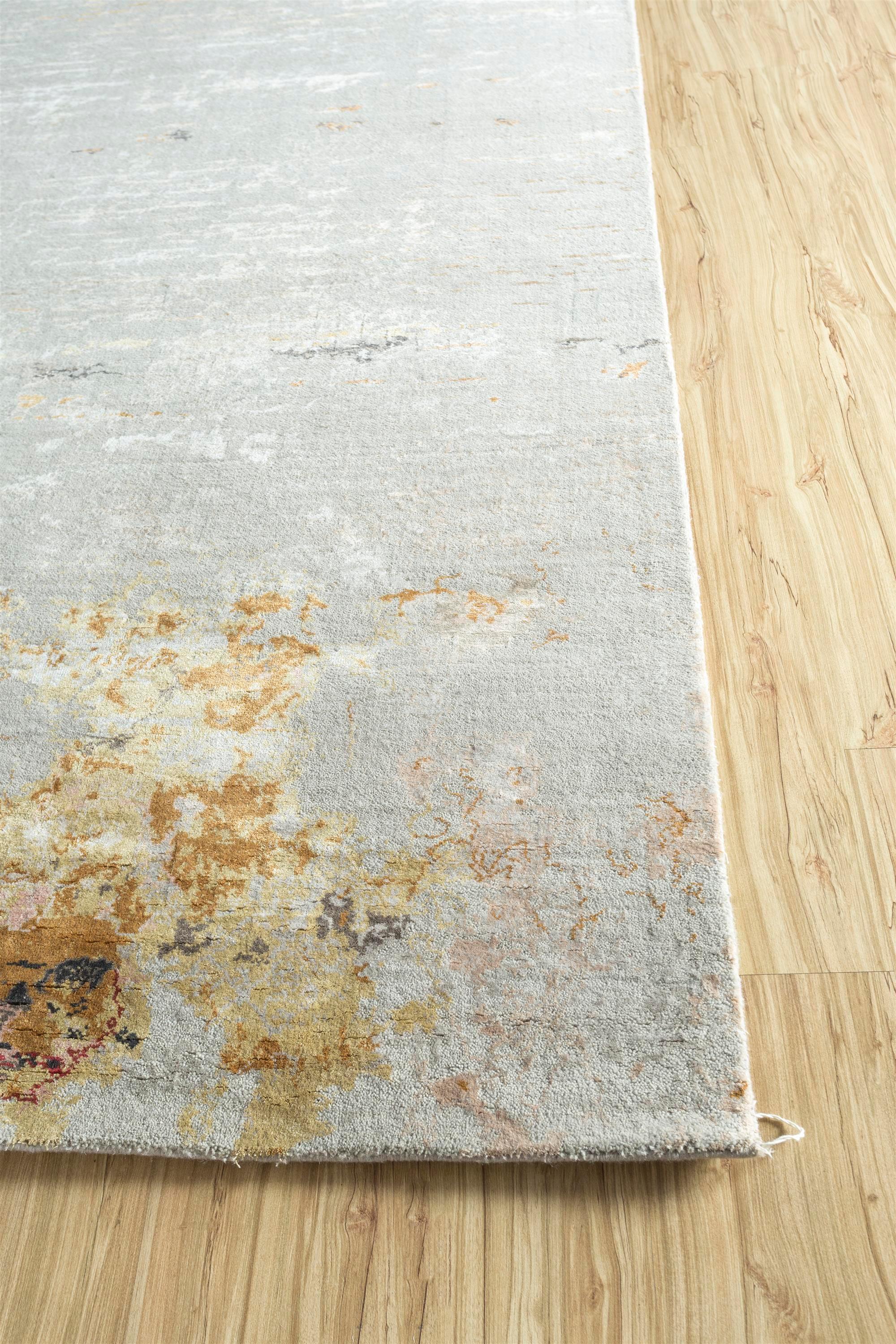 Embark on an artistic journey with the hand-knotted rug from the Unstring collection by Kavi, exclusively brought to you . This modern rug, expertly crafted from wool and bamboo silk, unveils the storytelling essence of rug-making in rural India.