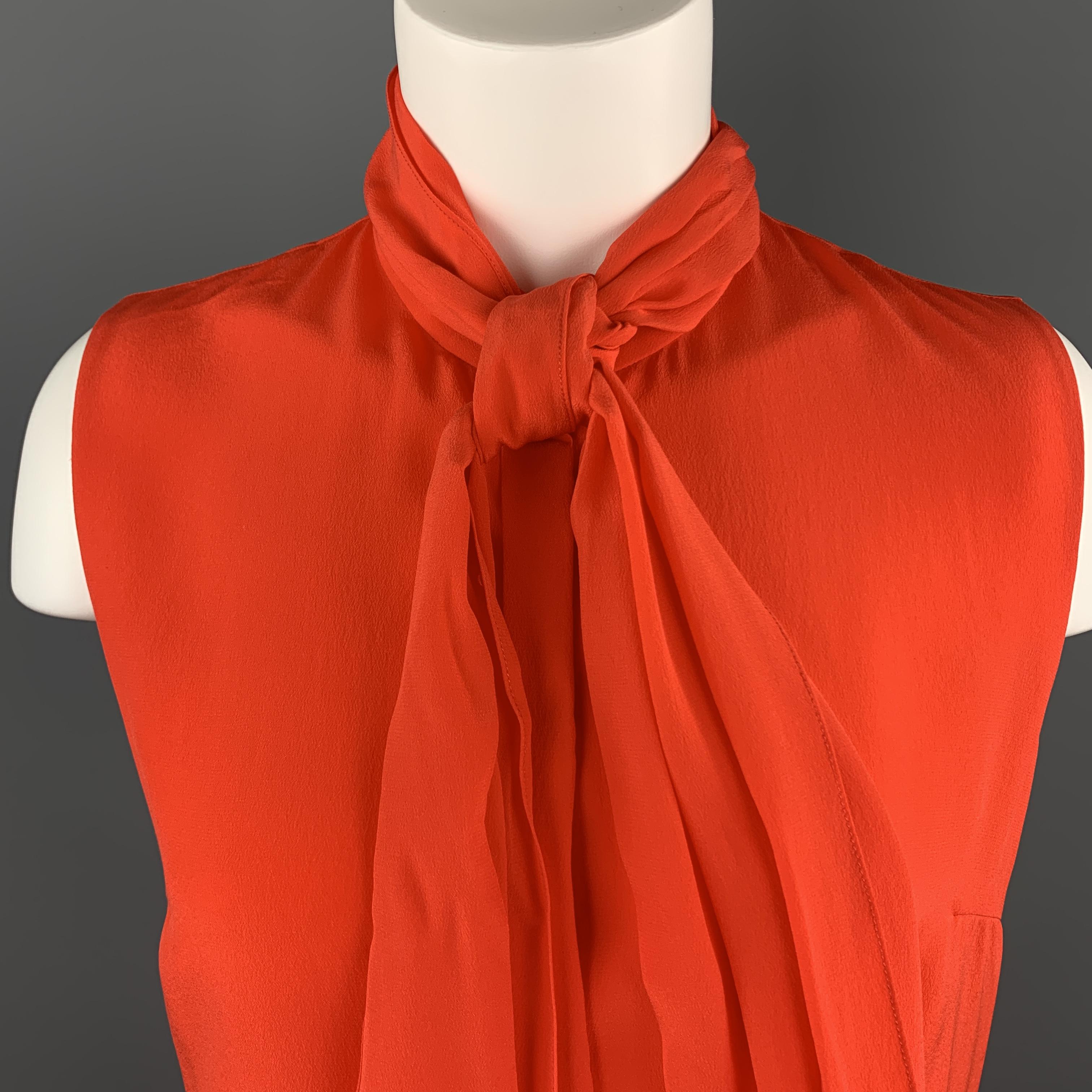 HONOR sleeveless blouse comes in a bold coral silk crepe chiffon with a band collar, hidden placket button front, and detachable bow tie collar. Made in USA.

New with Tags.
Marked: IT 40

Measurements:

Shoulder: 13.5 in.
Bust: 38 in.
Length: 26 in.