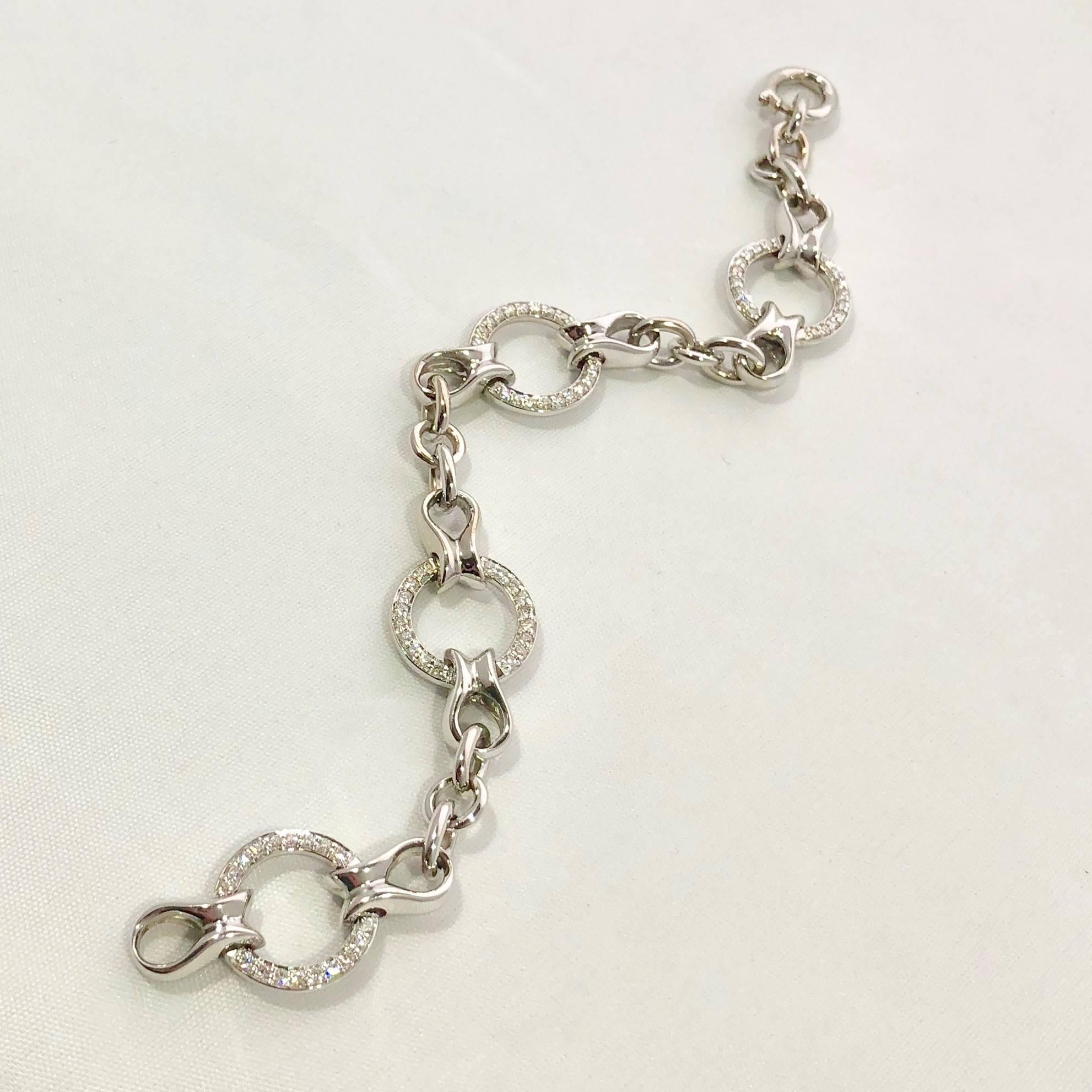 Honora 14 karat gold round diamond chain link tennis bracelet. This is a piece designed by HONORA, in 14 karat white gold and weighs 26.3 grams/ 17 dwt.  There are 72- full cut round diamonds = .59 carat total weight, average color G-H, average
