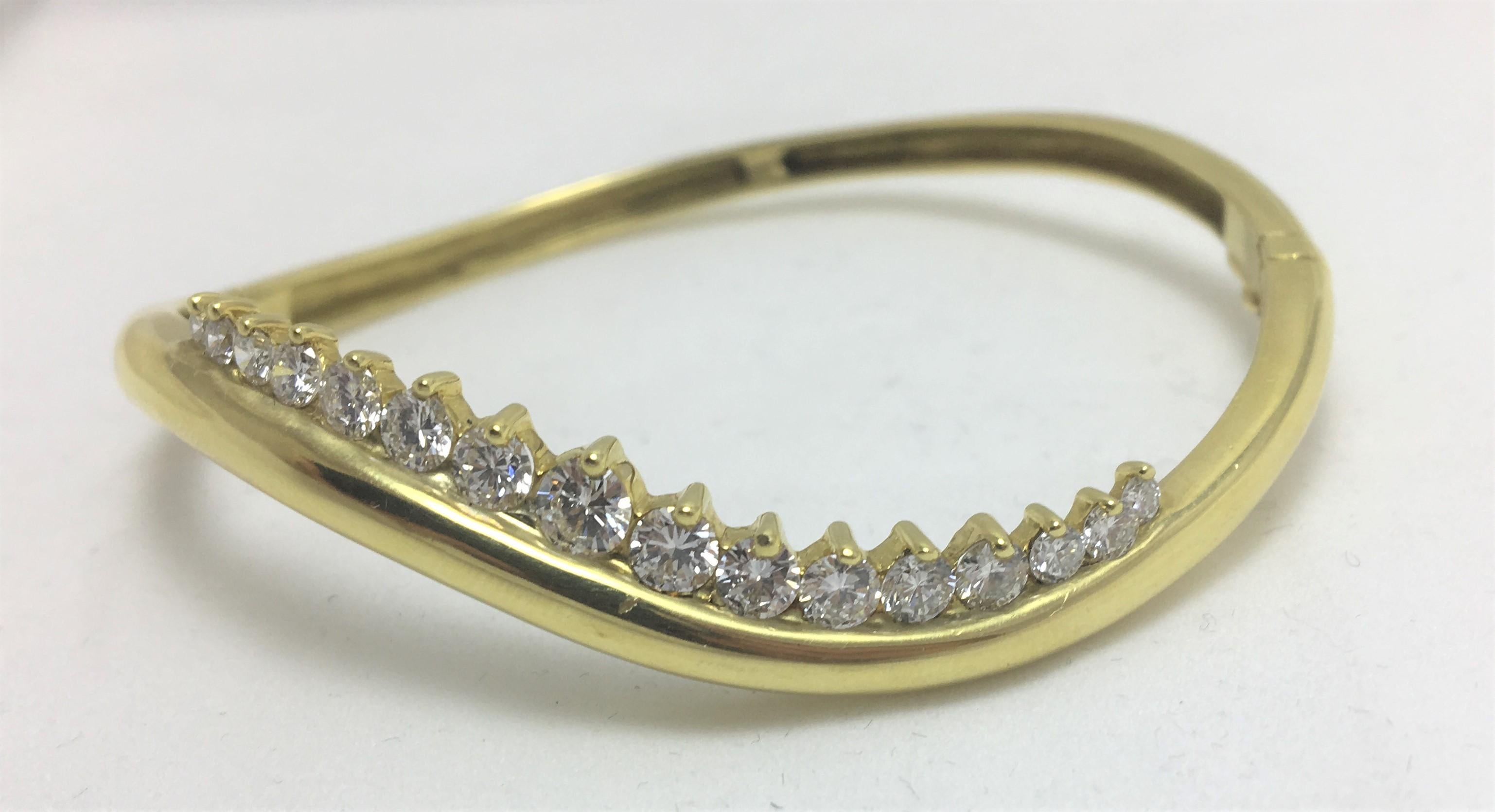 This bracelet is a unique 18K yellow gold 'wave' design with 16 diamonds
Honora Jewelry Co. Designer
1.77 total diamond weight
16 round diamonds ranging from approximately .12 carat to .01 carat, F-G color, VS clarity
18 Karat yellow gold 