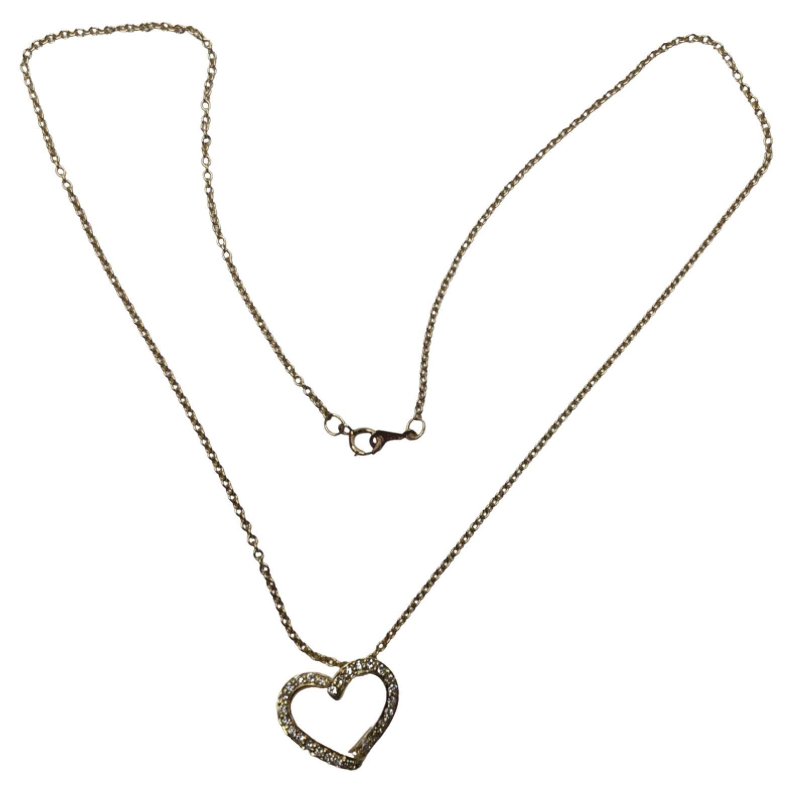 Honora 18K yellow Gold Diamond Heart Pendant with Chain.  There are 29, full cut round brilliant diamonds, for a total diamond weight of 0.22 carats. The diamonds are of VS clarity and G color. The heart is 17.0 mm x 15.0 mm. There is a hidden bail