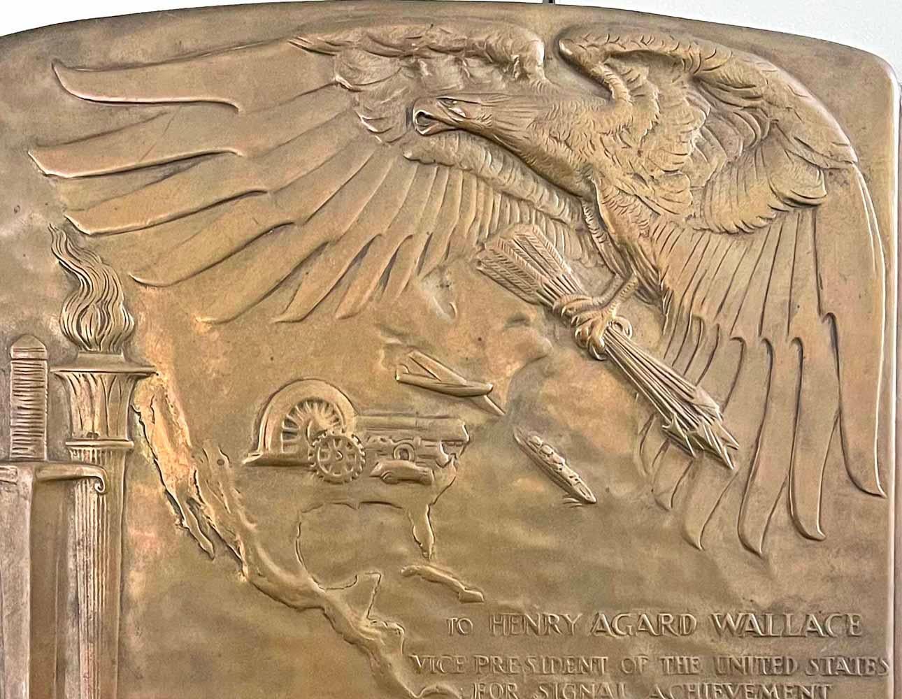 Highly important both artistically and historically, this high style Art Deco bronze panel, full of symbolism and patriotic fervor, was commissioned by B'nai B'rith and sculpted by René Paul Chambellan to honor Vice President Henry Agard Wallace on
