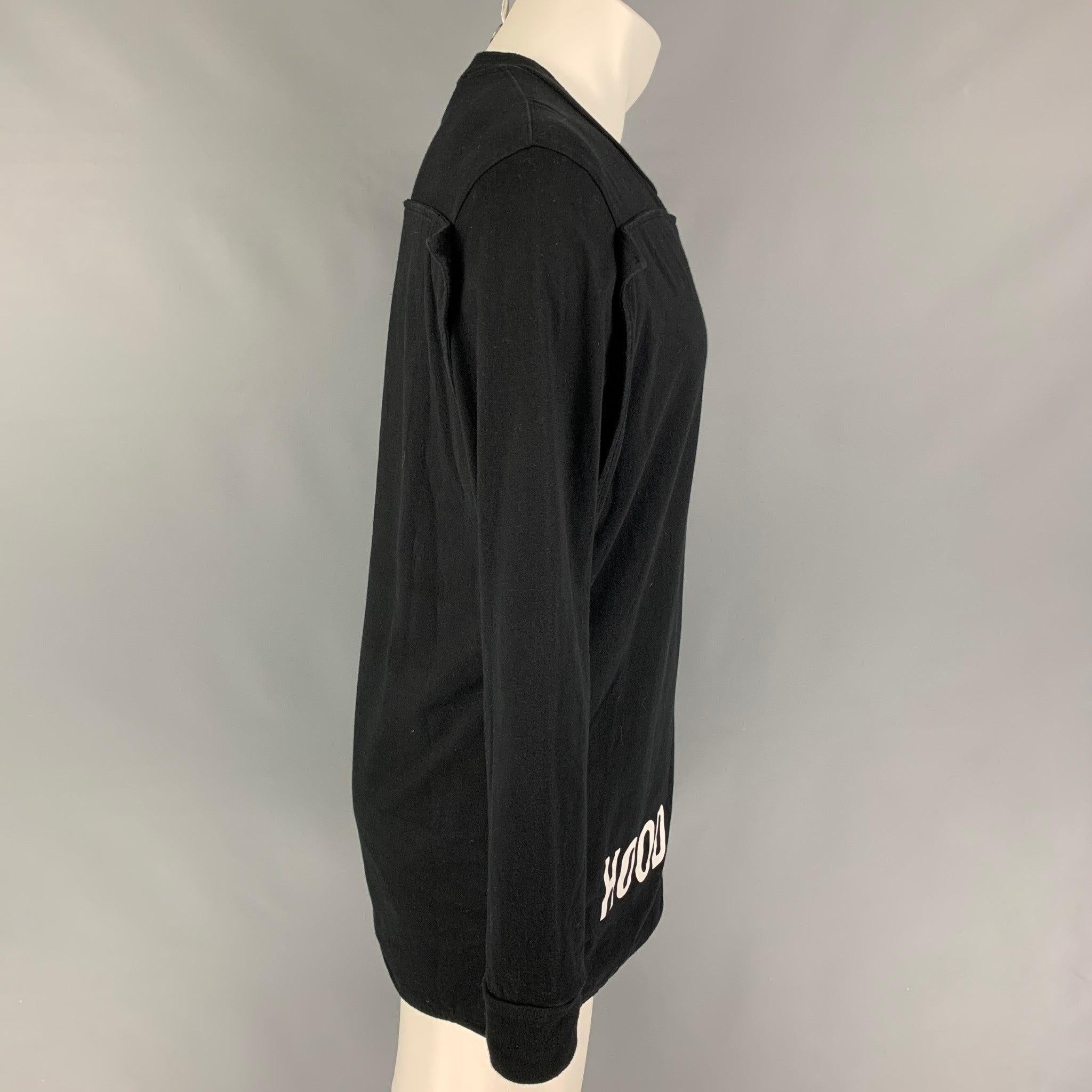 HOOD BY AIR t-shirt comes in a black cotton featuring a white logo detail, front & back panel detail, long sleeves, and a crew-neck.
Good
Pre-Owned Condition. 

Marked:   S 

Measurements: 
 
Shoulder:
18.5 inches  Chest: 40 inches  Sleeve: 26