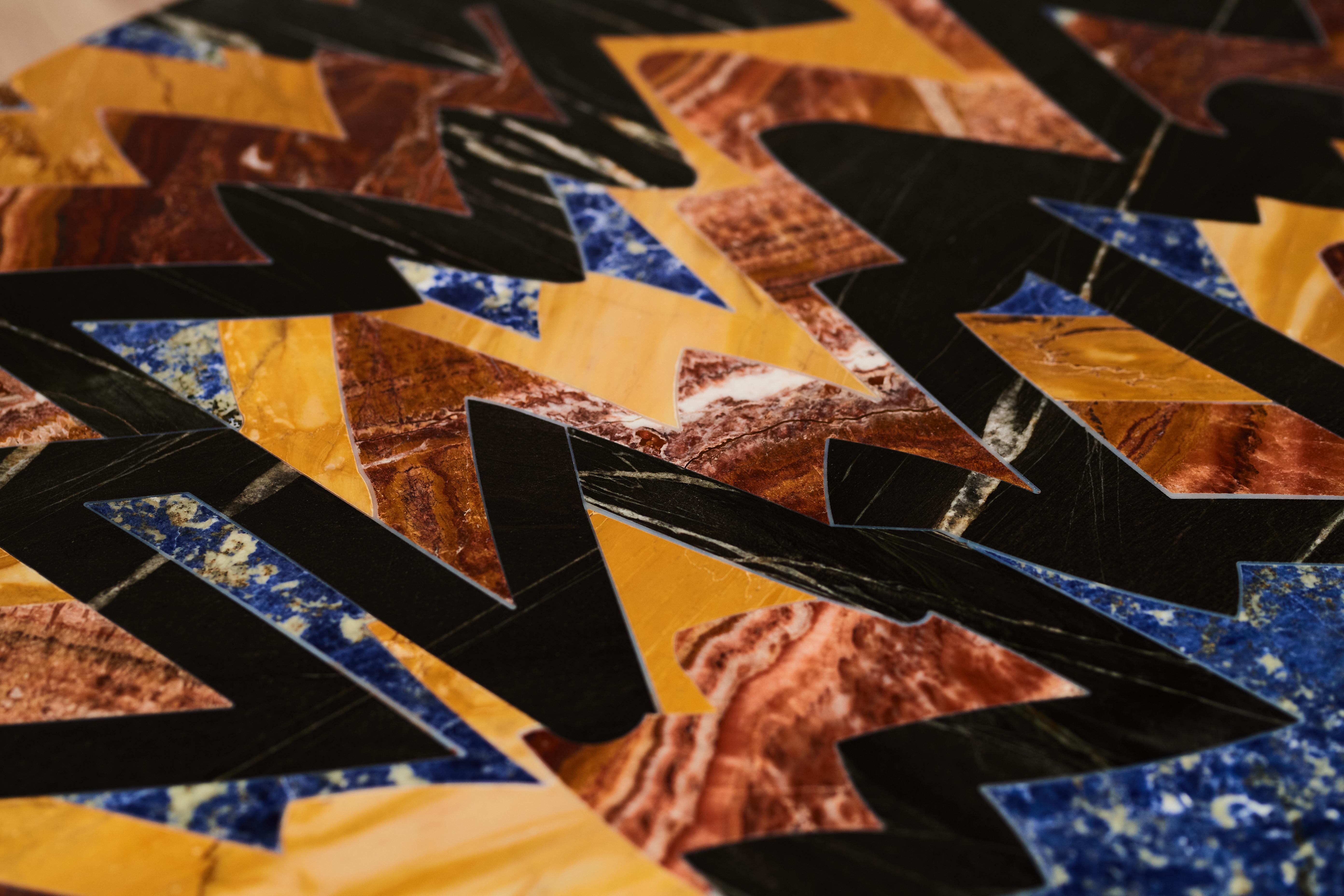 One of a kind table created by artist Rhys Coren in collaboration with artisanal marble expert Peter Noyce. 

A collage of Imperial Black granite, Asul Bahia granite, Jasper Red marble and Giallo Siena marble,  bonded and polished.

This table comes