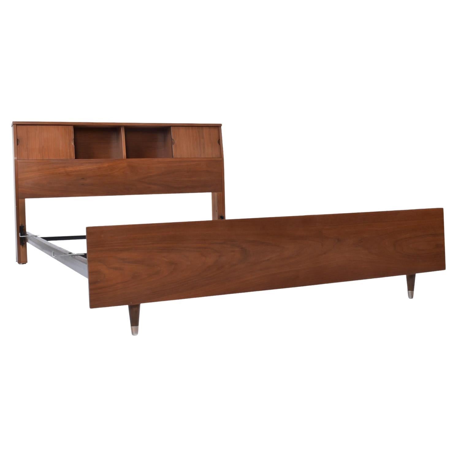 The metal frame is included!

Mid-Century Modern bookcase headboard and matching footboard by Hooker. The Hooker Mainline collection is beloved by collectors for its minimalist silhouette, fine walnut wood, and neatly tailored embellishments. This