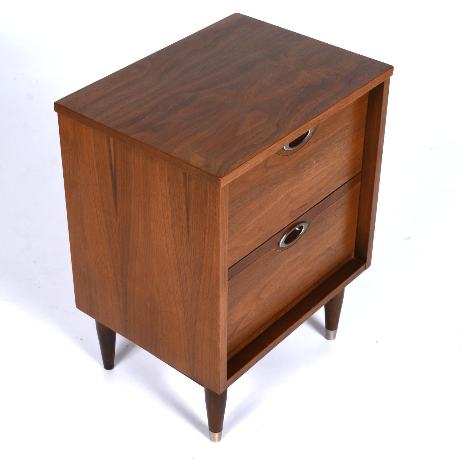This listing is for a single nightstand. 

Handsome mid-century modern nightstand by Hooker. The Mainline collection features premium walnut casegoods. This Hooker Mainline nightstand is a workhorse when it comes to storage. Two ample drawers