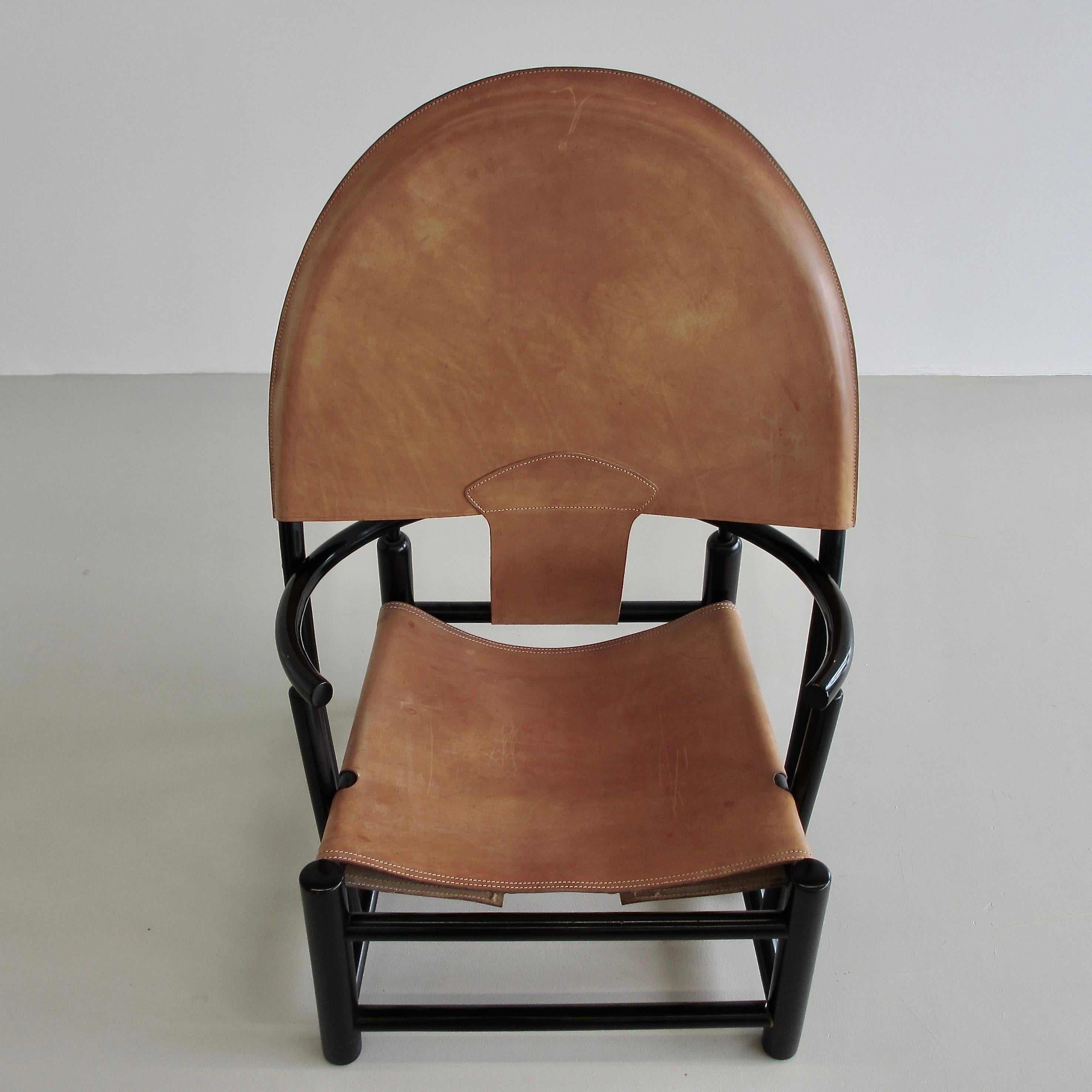 Armchair designed by Piero Palange and Werther Toffolon. Italy, Germa, 1972.

Black lacquered wooden frame with the original leather upholstery. This is model G23. Seat height: 35 cm.