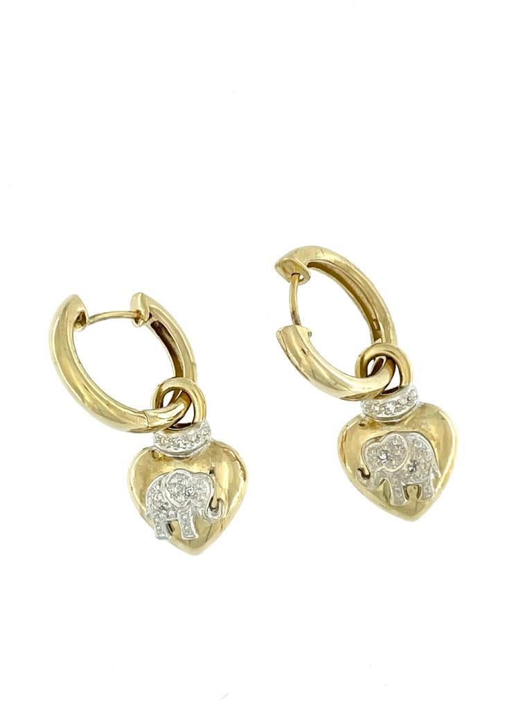 The Hoop Dangle Earrings are a stunning piece of jewelry that exudes elegance and charm. 

The earrings feature a classic hoop dangle design, adding a touch of sophistication to any ensemble. 
Crafted with meticulous attention to detail, these