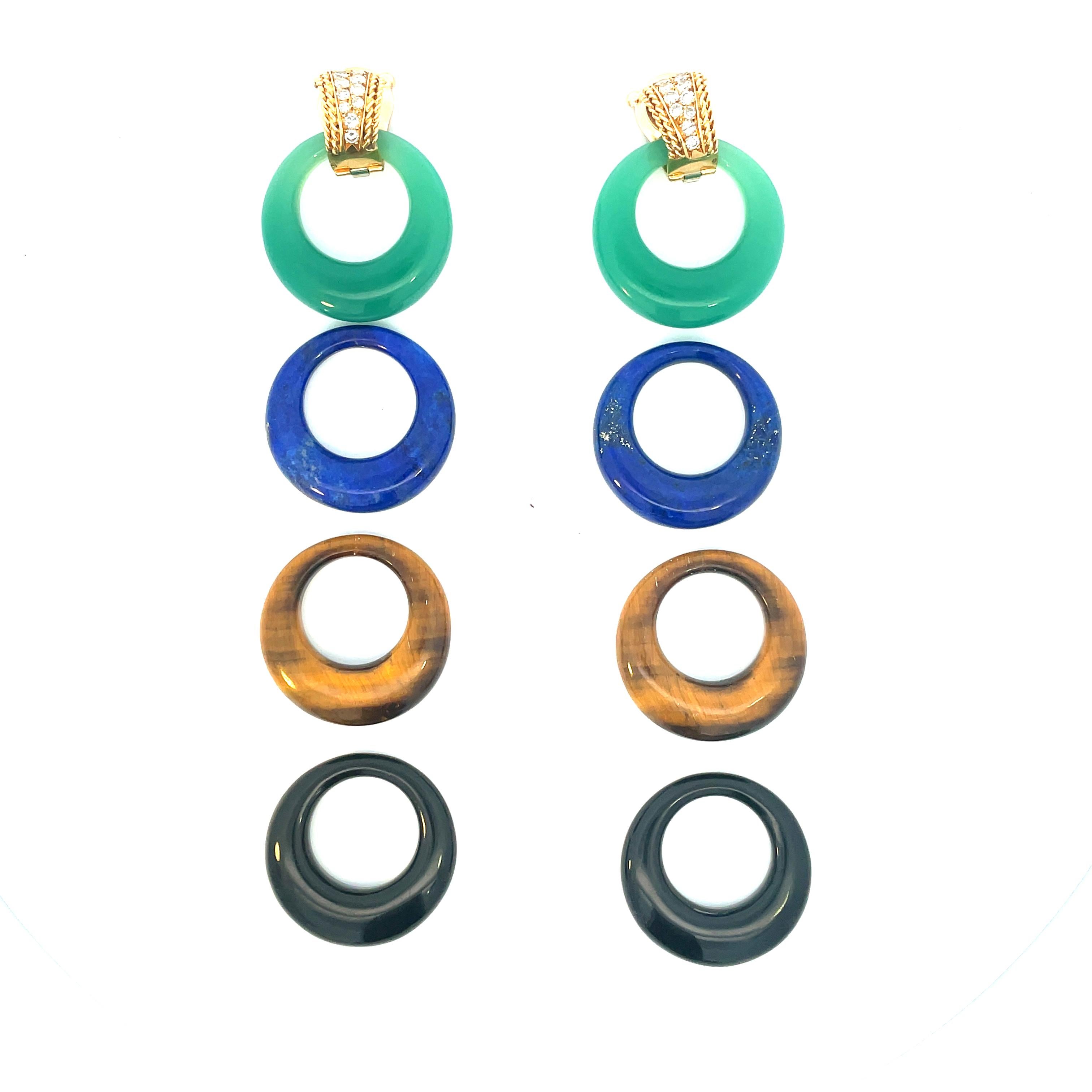 These are rare vintage VCA lever-back earrings are crafted in 18K yellow gold  and completed with 4 pair of interchangeable gemstone hoops: Lapis lazuli, Jadeite , Tiger`s Eye and Onix. Since the firm's inception in 1896, Van Cleef & Arpels has been