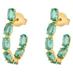 Hoop earring with emeralds in 18k yellow gold