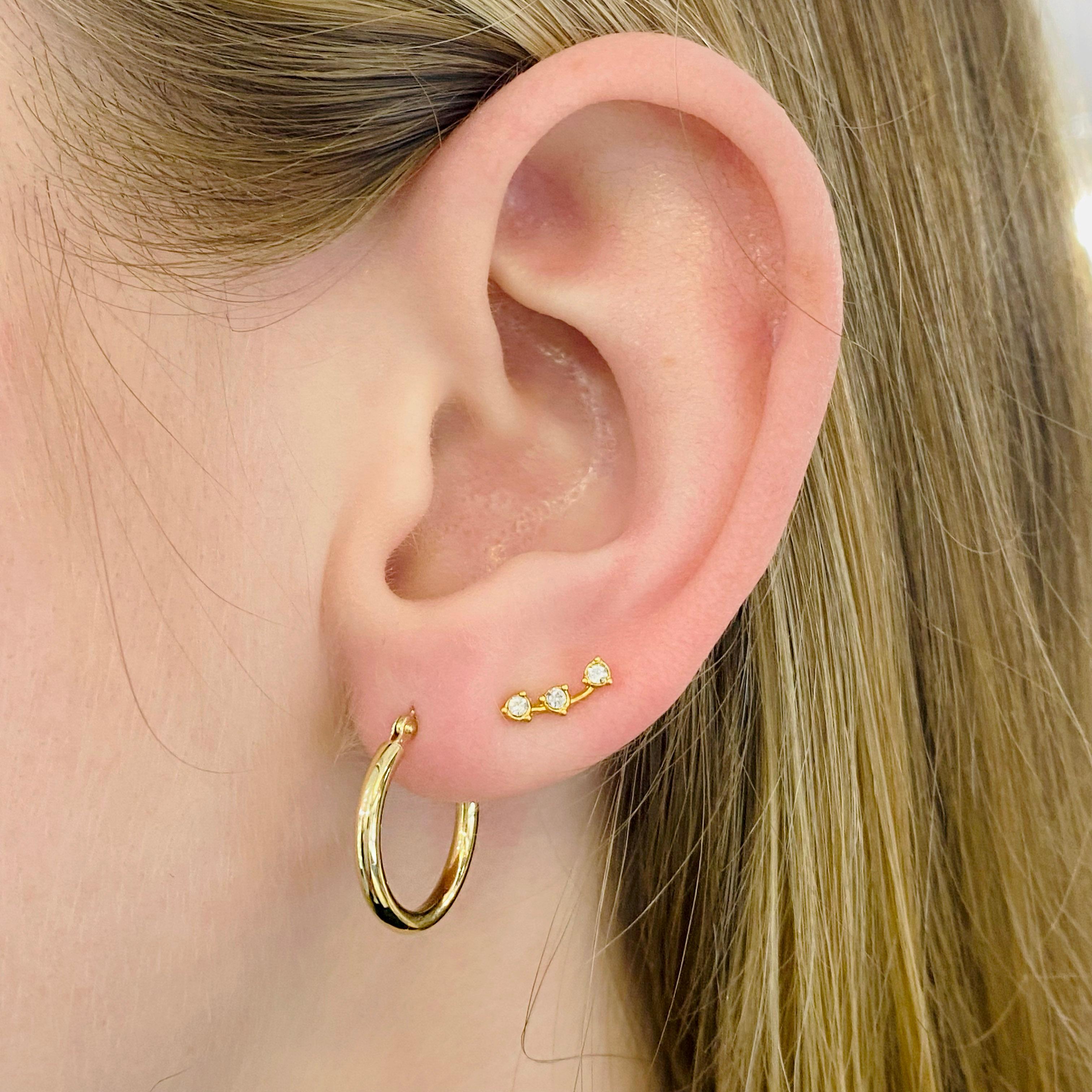 Gold hoop earrings are a staple in fine jewelry! These classic earrings are timeless and upgrade any outfit! The 14 karat yellow gold hoops are lightweight and comfortable to wear. They have a high polish finish  and an easy-to-use clasp. The
