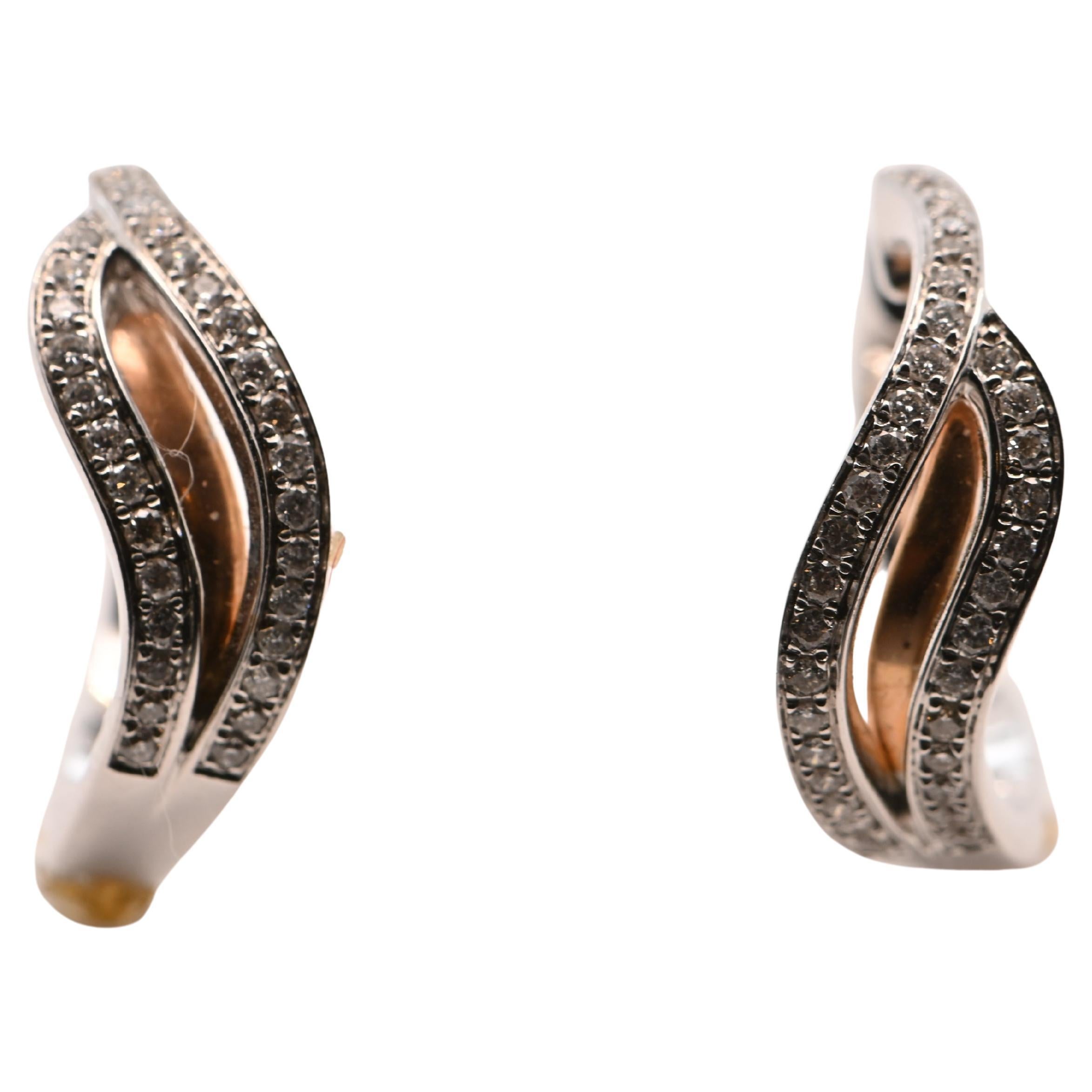 Hoop Earrings, Diamonds 0 . 310 Carats, Two-Tones Gold 18K

- Main Material : 18K gold (white gold with a rose gold insert).  
- Total Gold Weight : 5.20 grams, ensuring exceptional quality and durability.  
- Precious Stones :  
  - Type: Natural
