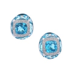 Orecchini a cerchio in oro bianco 18kt con topazio blu e diamanti