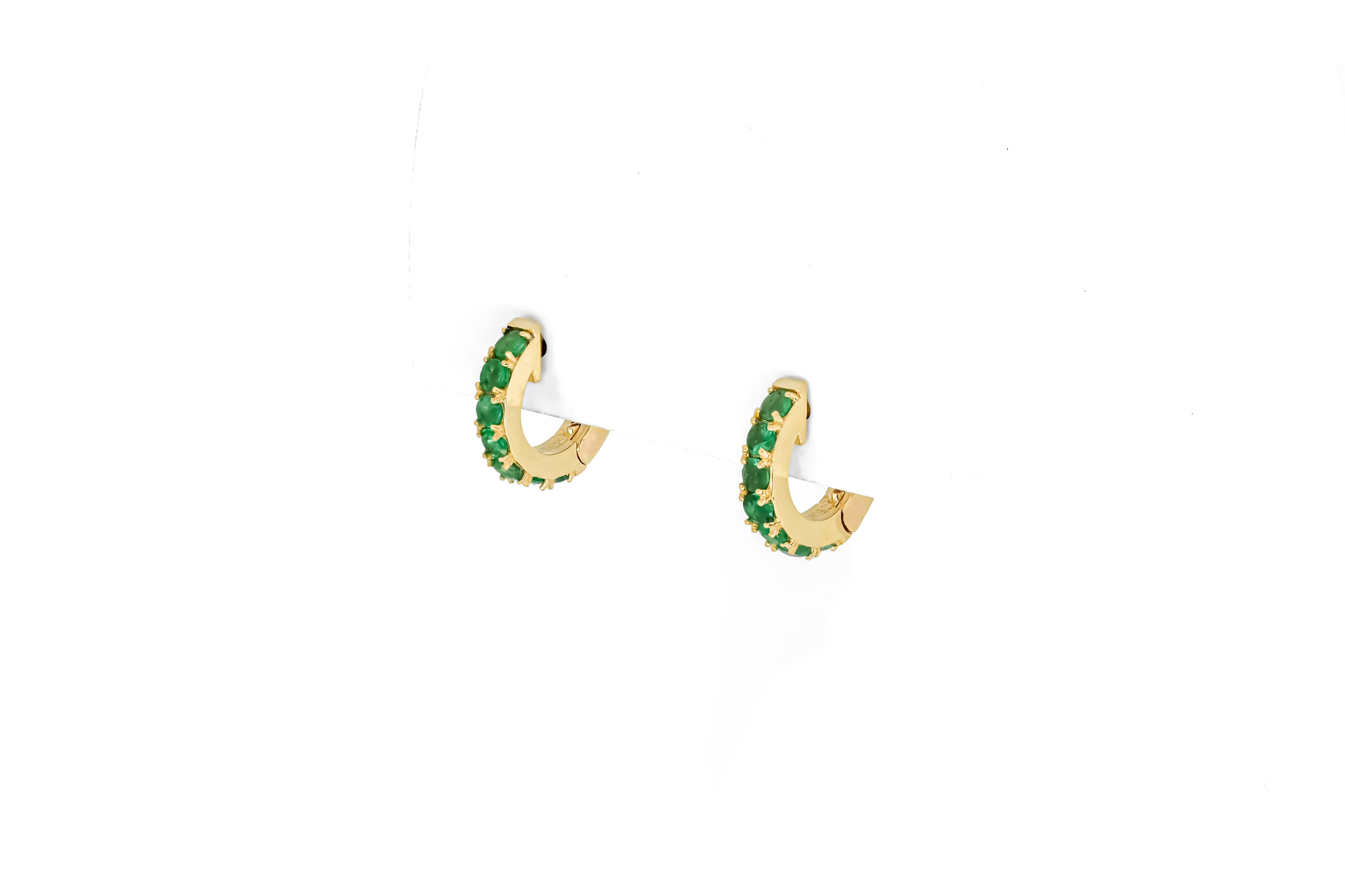 Round Cut Hoop Earrings with Emeralds, Huggy Hoop Emerald Earrings in 14 Karat Gold For Sale