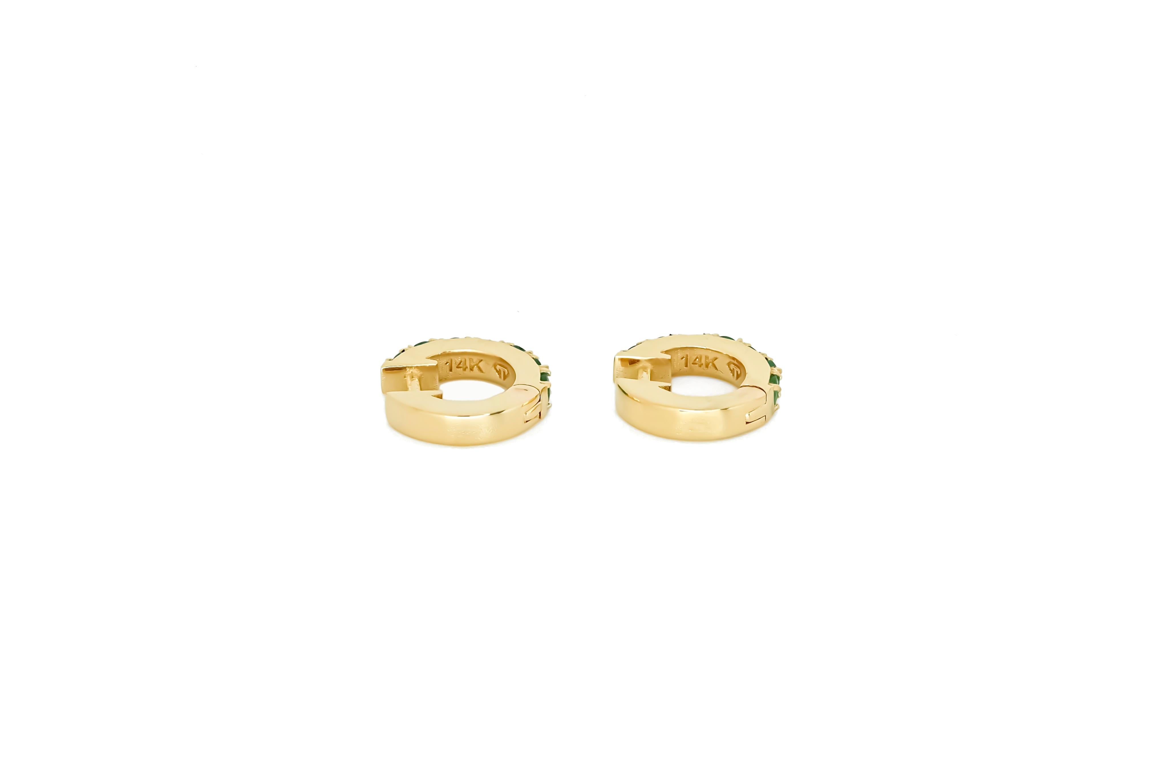 Round Cut Huggy Hoop Earrings with green gems in 14k gold  For Sale