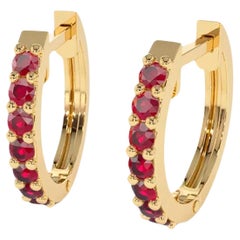 Huggy Hoop Earrings with red gems  in 14k gold 