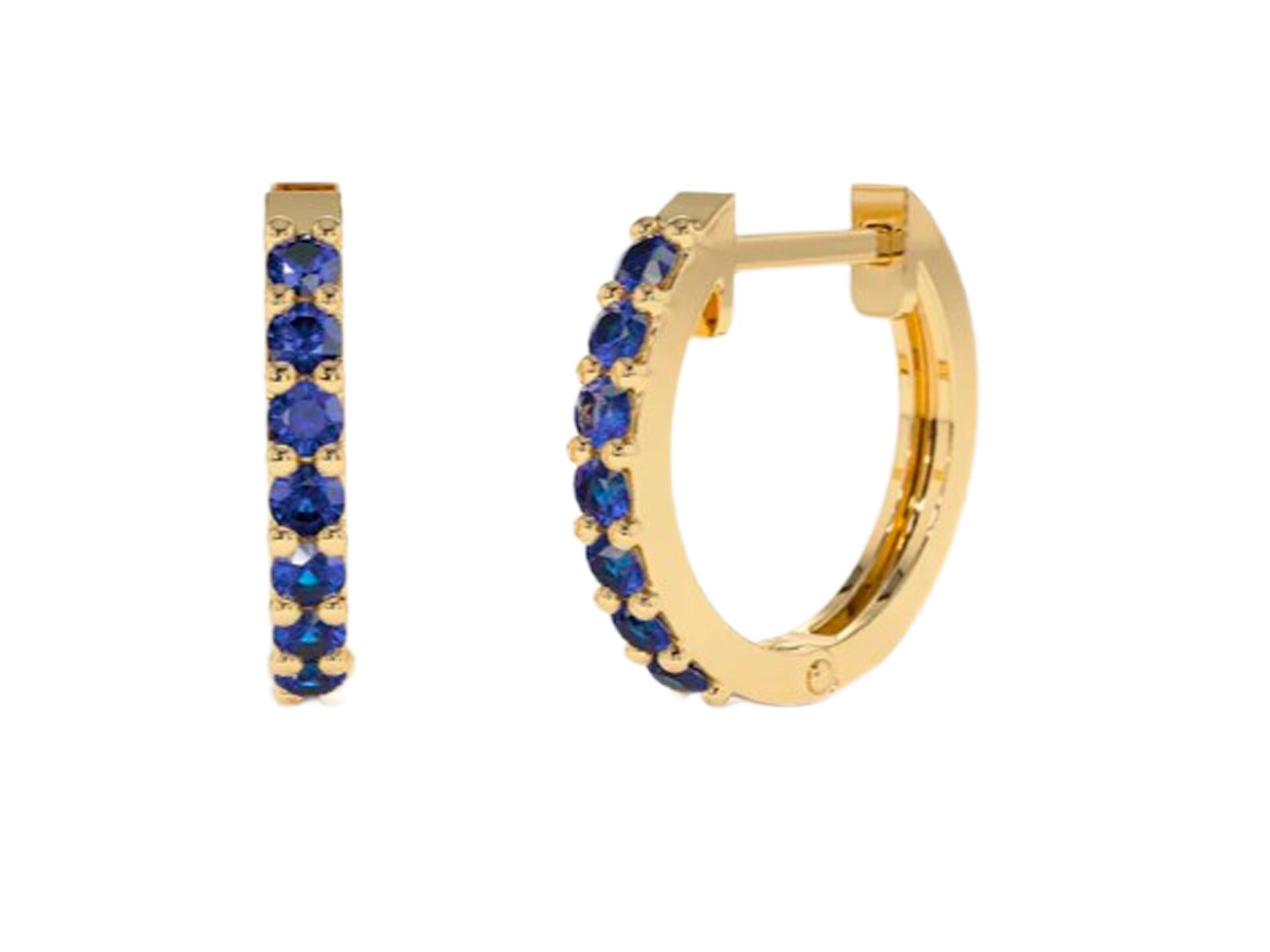 Hoop Earrings with Lab Sapphires. Huggy hoop sapphire earrings in 14 Karat Gold

Metal: 14kt solid gold
Earring size:
The Inner diameter of Earrings: 10MM
The Outer diameter of Earrings: 12MM
Weight: 2.2. g.

Gemstones:
Lab sapphires: 14 piece,