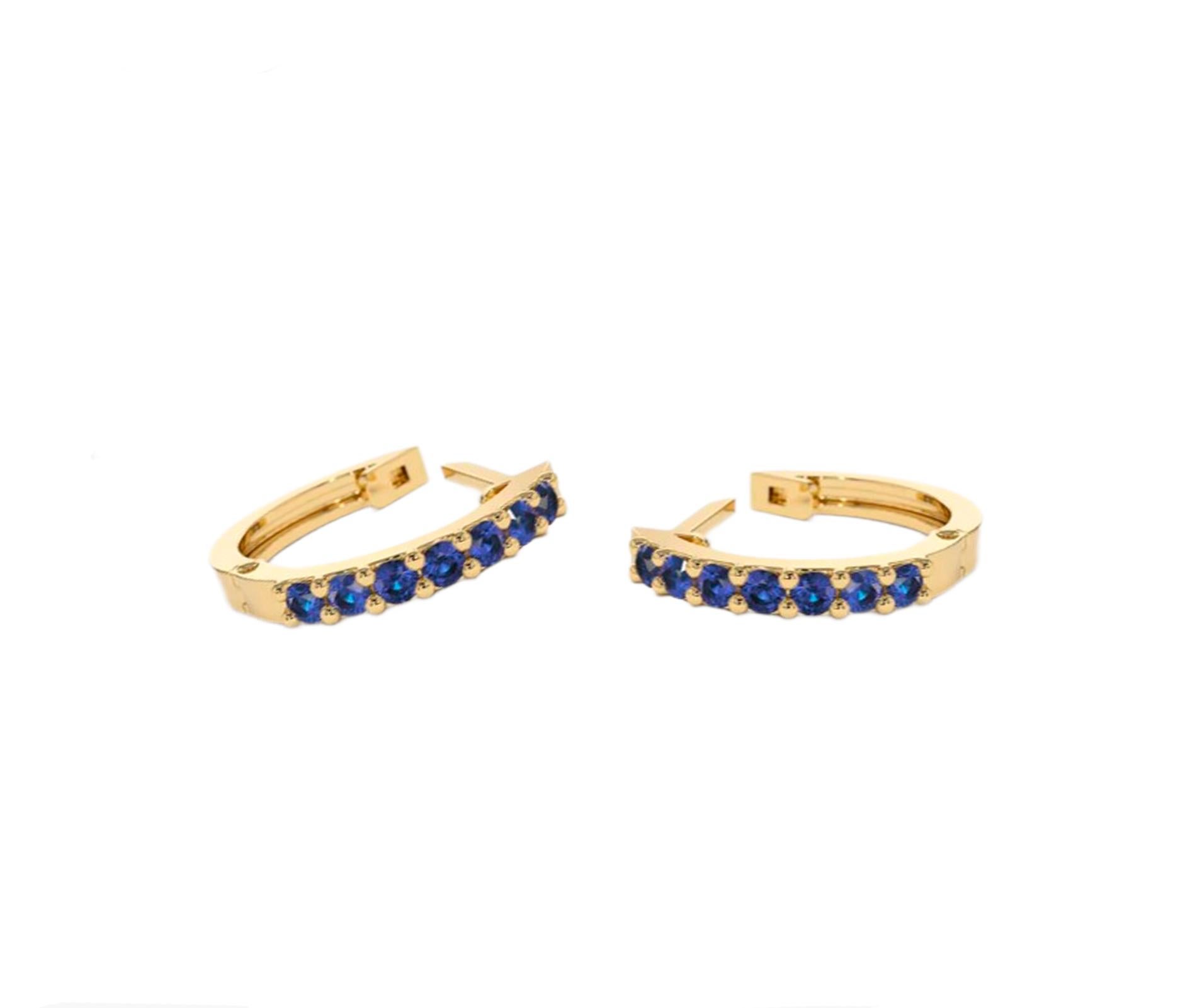 Women's Huggy Hoop Earrings with blue gemstones n 14k gold  For Sale