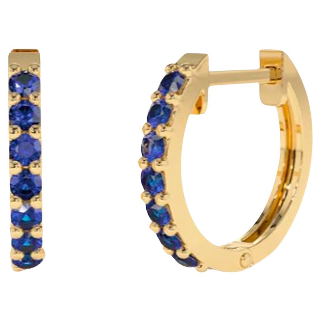 Huggy Hoop Earrings with blue gemstones n 14k gold 