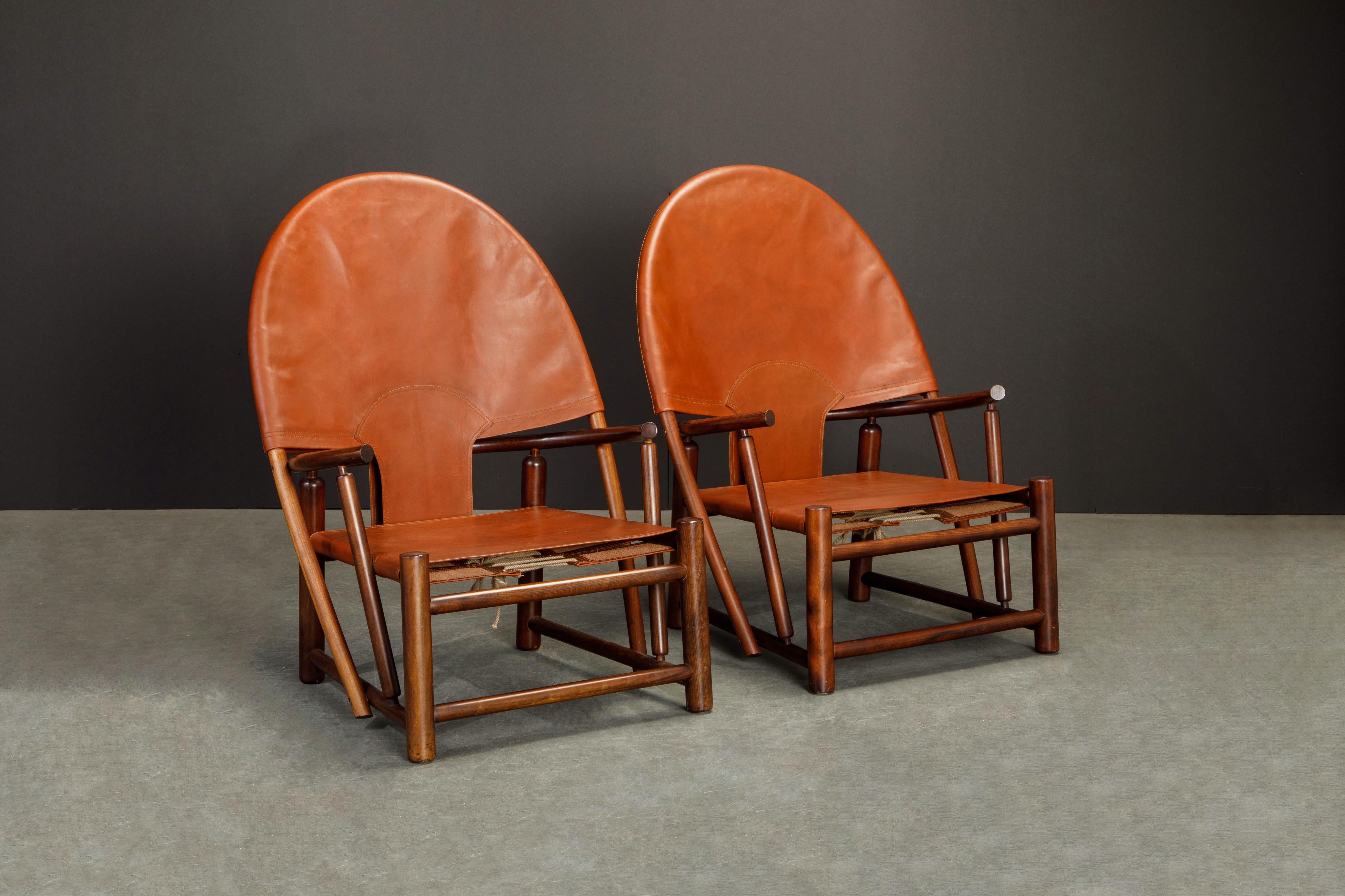 Our favorite color-way for this unique and rare design, the model G-23 'Hoop' lounge chairs by Piero Palange and Werther Toffoloni for Germa, Italy, circa 1970 and best of all we have a matching pair. The deep brown leather slings sitting atop the