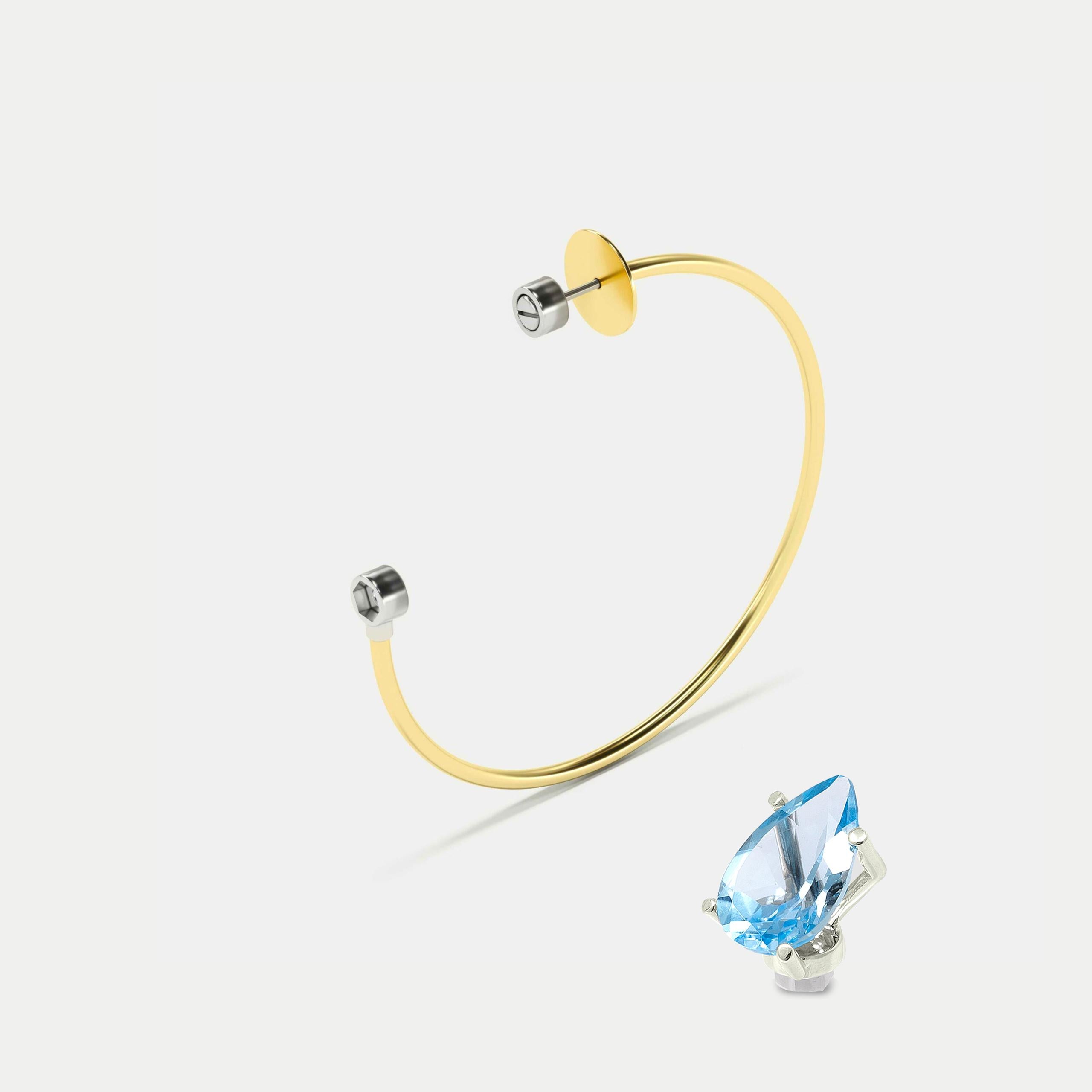 Mono hoop earring with removable blue light blue topaz, 18K.

-Hoop earring (60 mm ⌀ ) Yellow gold, 18K. 
-Blue sky topaz, pear-cut White gold head, 18K.
-Post and bracket are made of steel, which provides a secure closure of the earring and