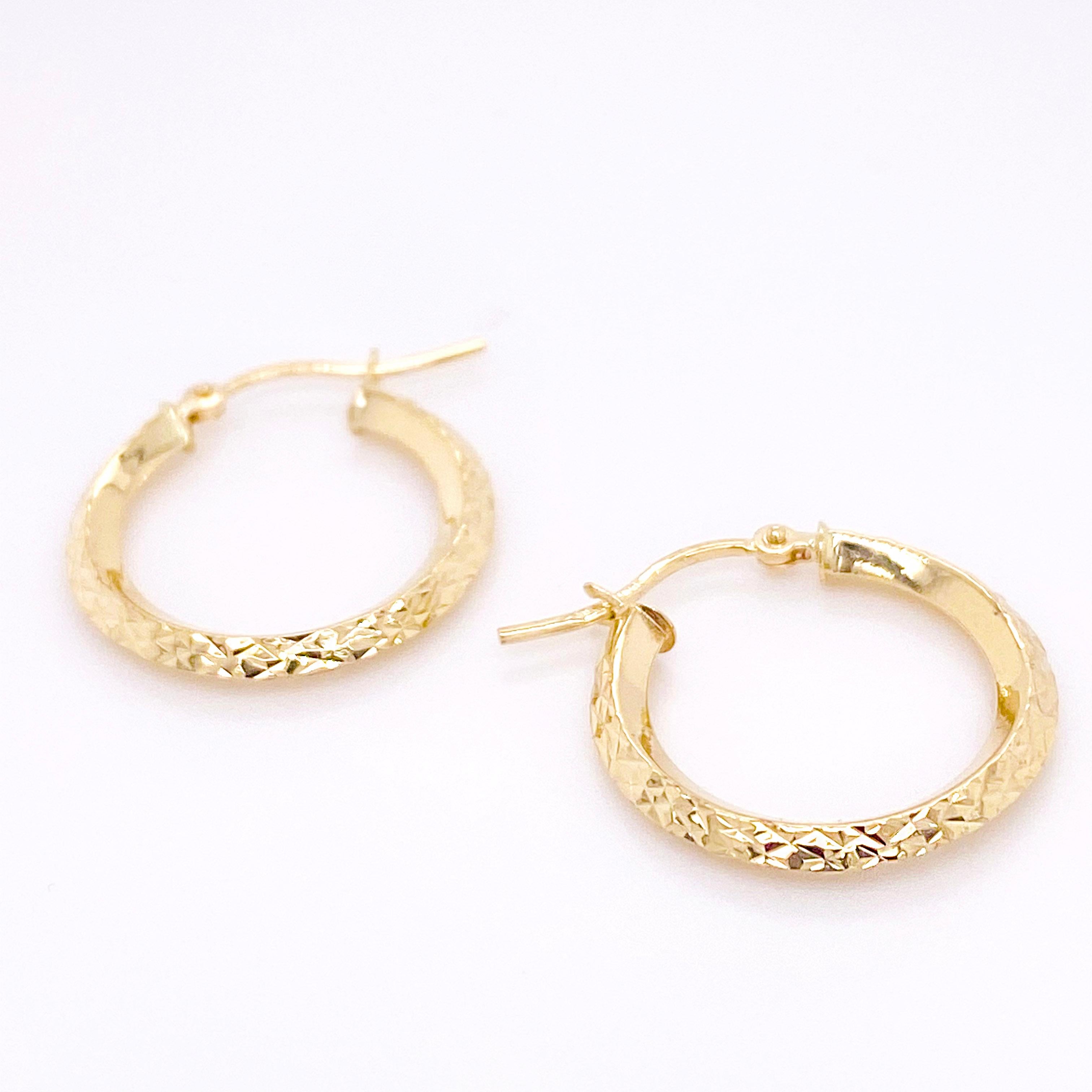 The diamond-cut hoop earrings are the bomb! They are the perfect size by being about the size of a quarter. They are semi-solid so that they feel really light-weight on your earlobe. The sparkly design is very popular and will show the reflection of