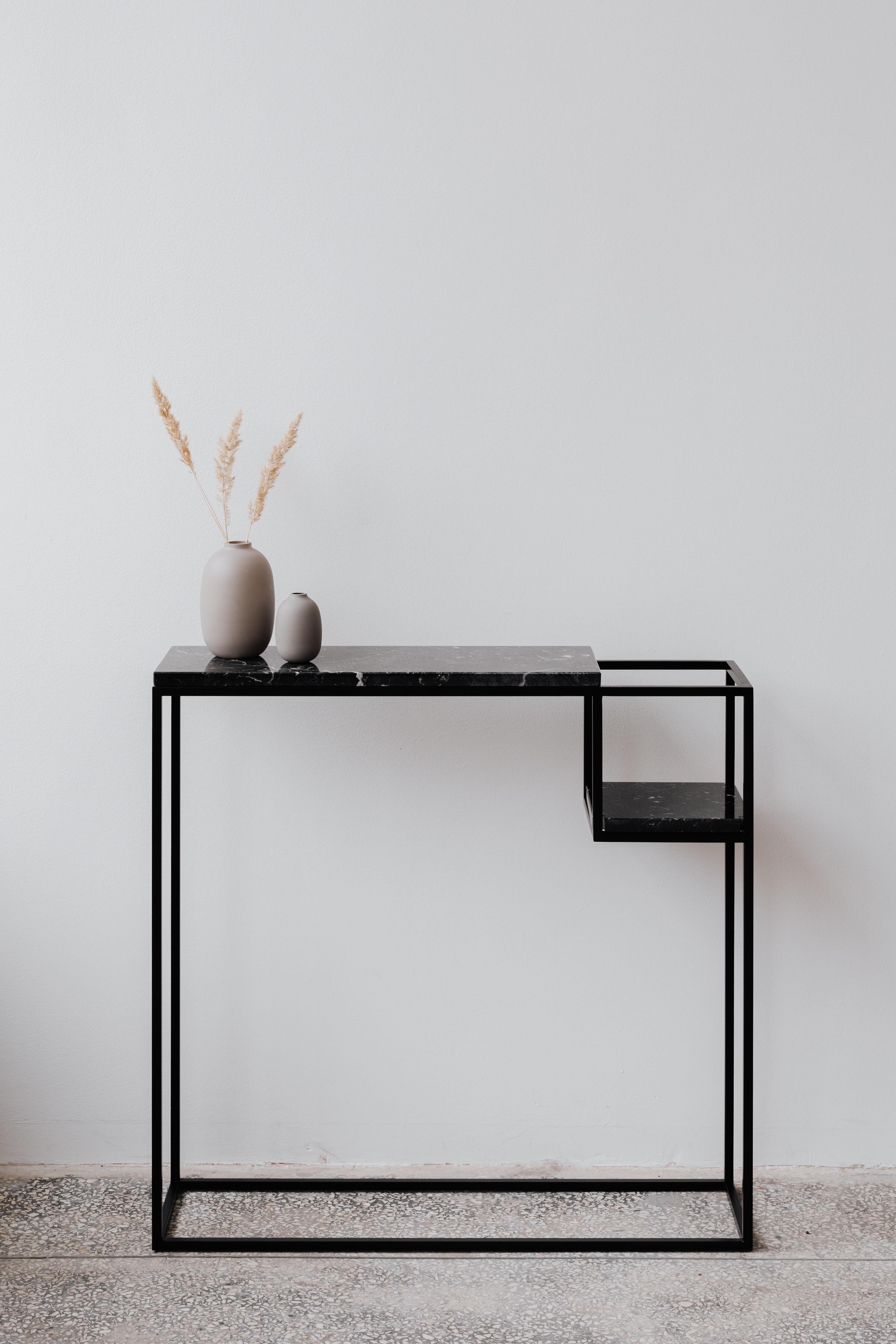 Hop Console Table by Un’common
Designed by Małgorzata Korycka.
Dimensions: D 20 x W 75 x H 75 cm.
Materials: Steel and Nero Marquina marble.

Available in different marble options. Please contact us.

The HOP accessory console is a graceful piece of