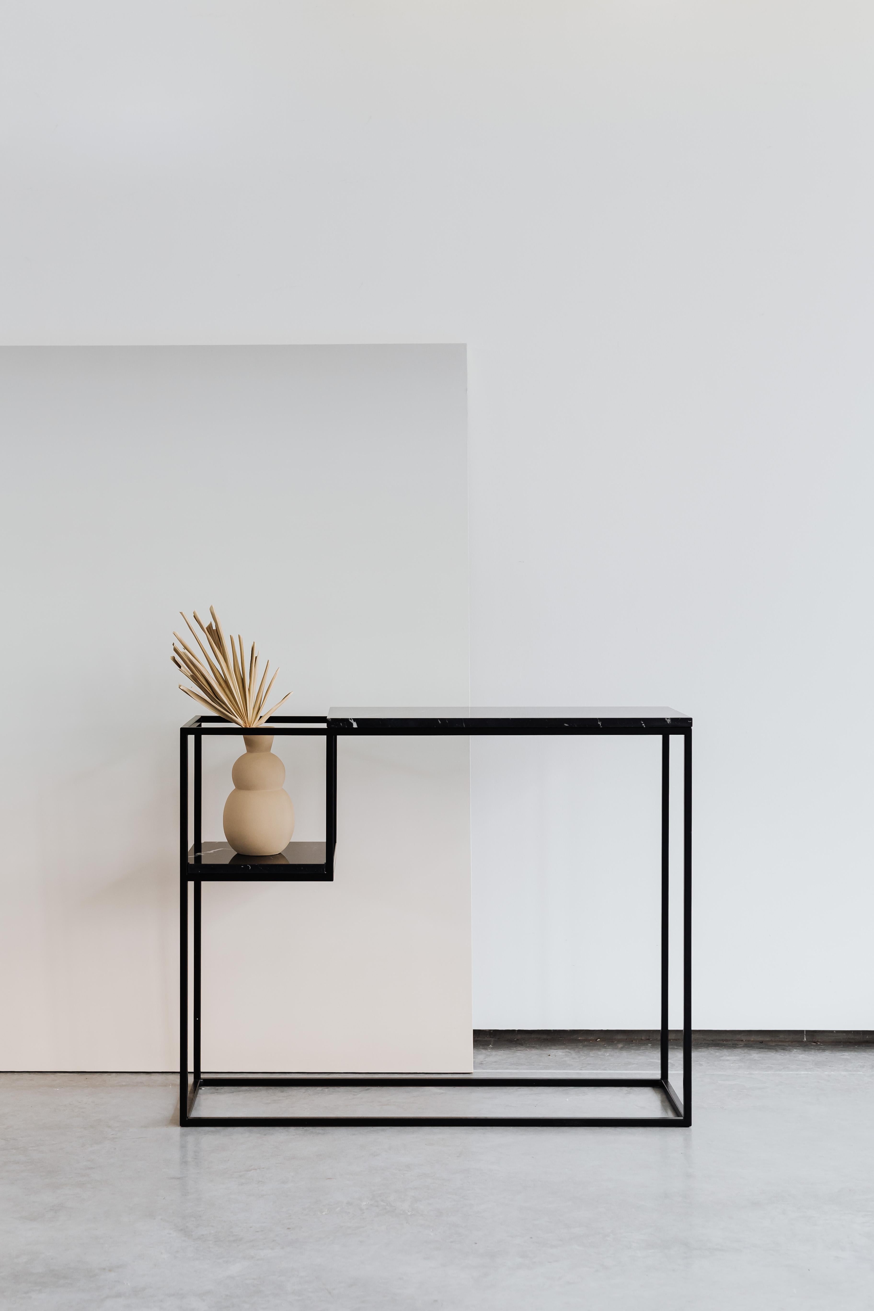 Hop Maxi Console Table by Un’common
Designed by Małgorzata Korycka.
Dimensions: D 20 x W 75 x H 75 cm.
Materials: Steel and Nero Marquina marble.

Available in different marble options. Please contact us.

The HOP MAXI console has a marble top on a