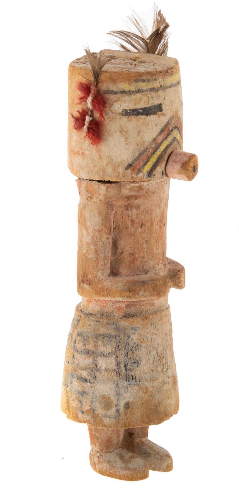 A Hopi carver and painted wood Kachina Doll. Late 19th century: cottonwood with earthen pigments, enhanced with a few feathers and dyed wool tufts. A rare early Hopi Kachina Doll. Kasina.