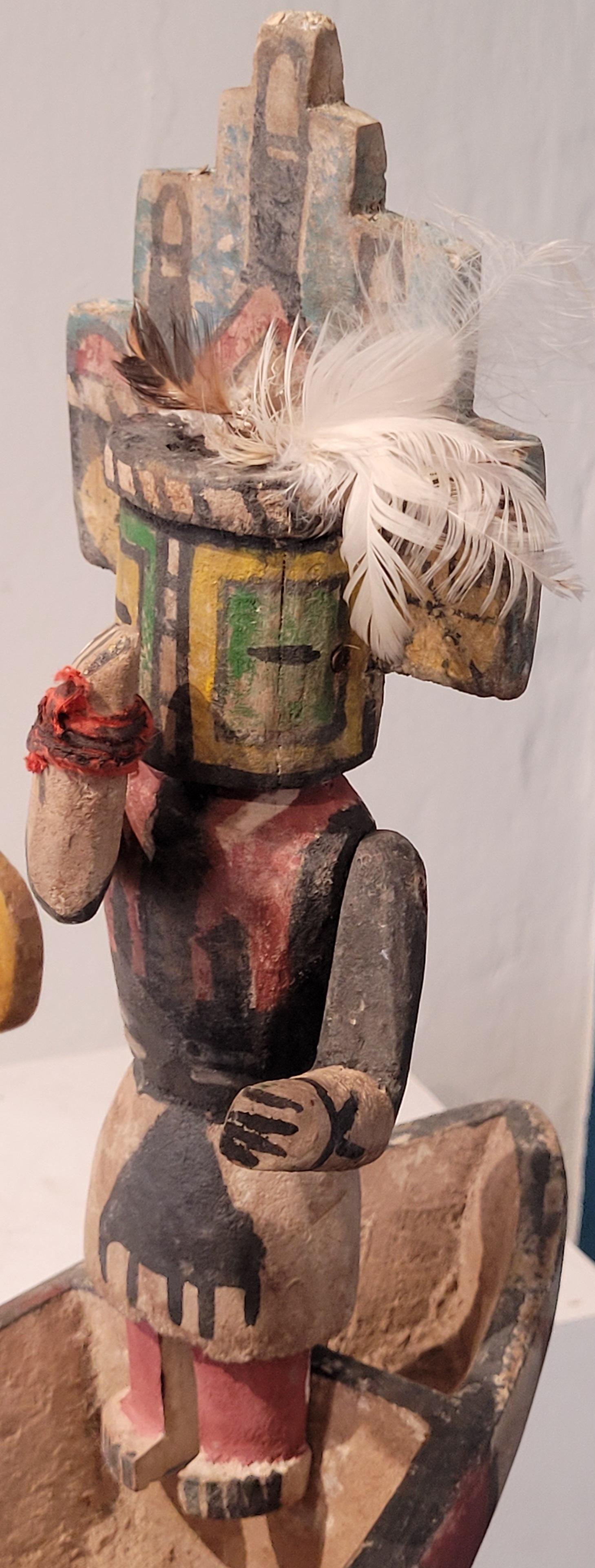 A group of four Native North American carved wood and painted effigy figures, Hopi Katsina or Kachina dolls paddling their canoe.

Four wonderfully playful, brightly coloured and highly individual Hopi Katsina dolls. Each doll representing a