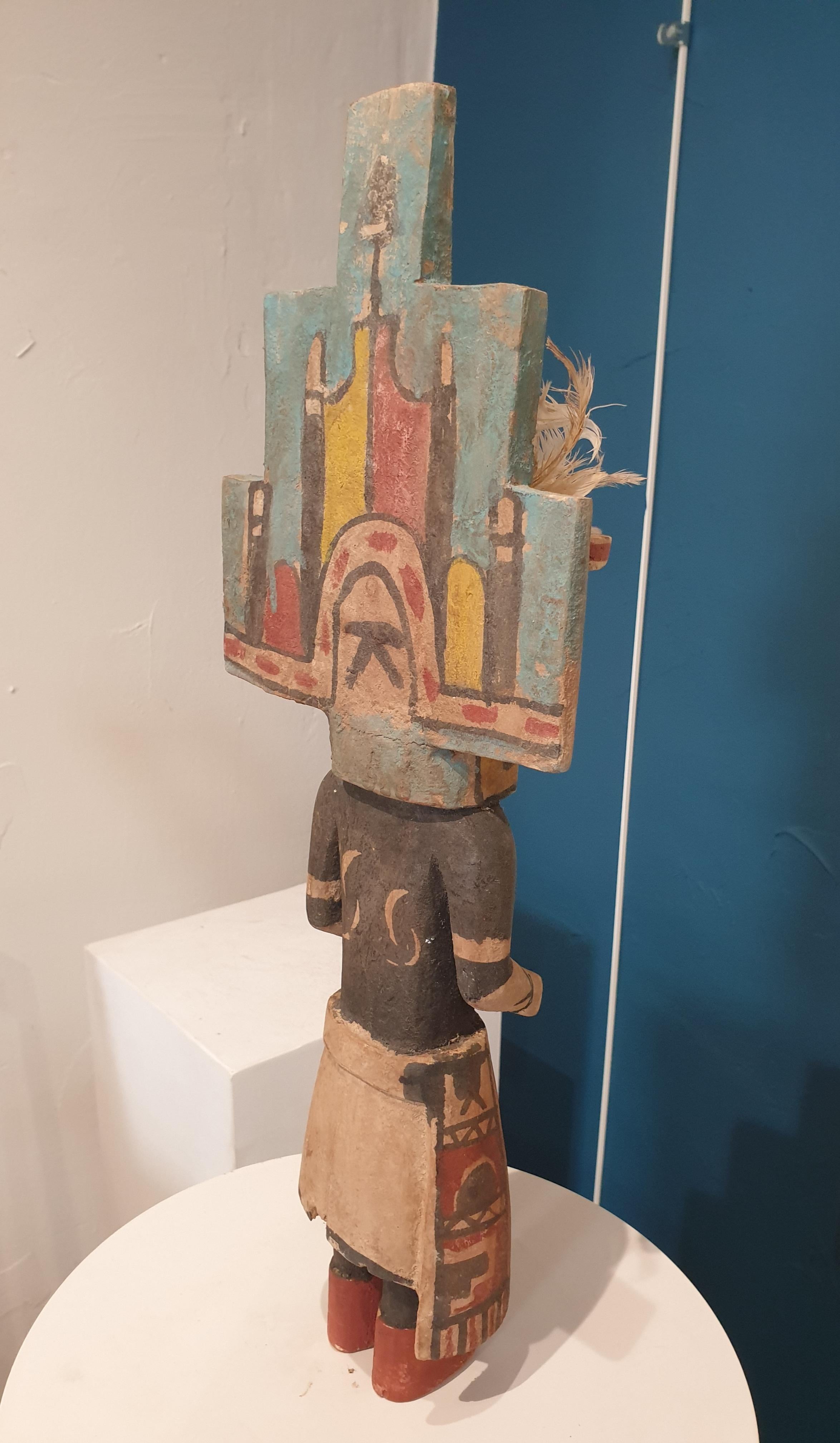 Native North American carved wood and painted effigy figure, Hopi Katsina or Kachina doll. This is one of a group of eight dolls all individually priced, or available as a set, and on 1stdibs. 

Hopi Katsina dolls are wooden effigies of the Katsinam