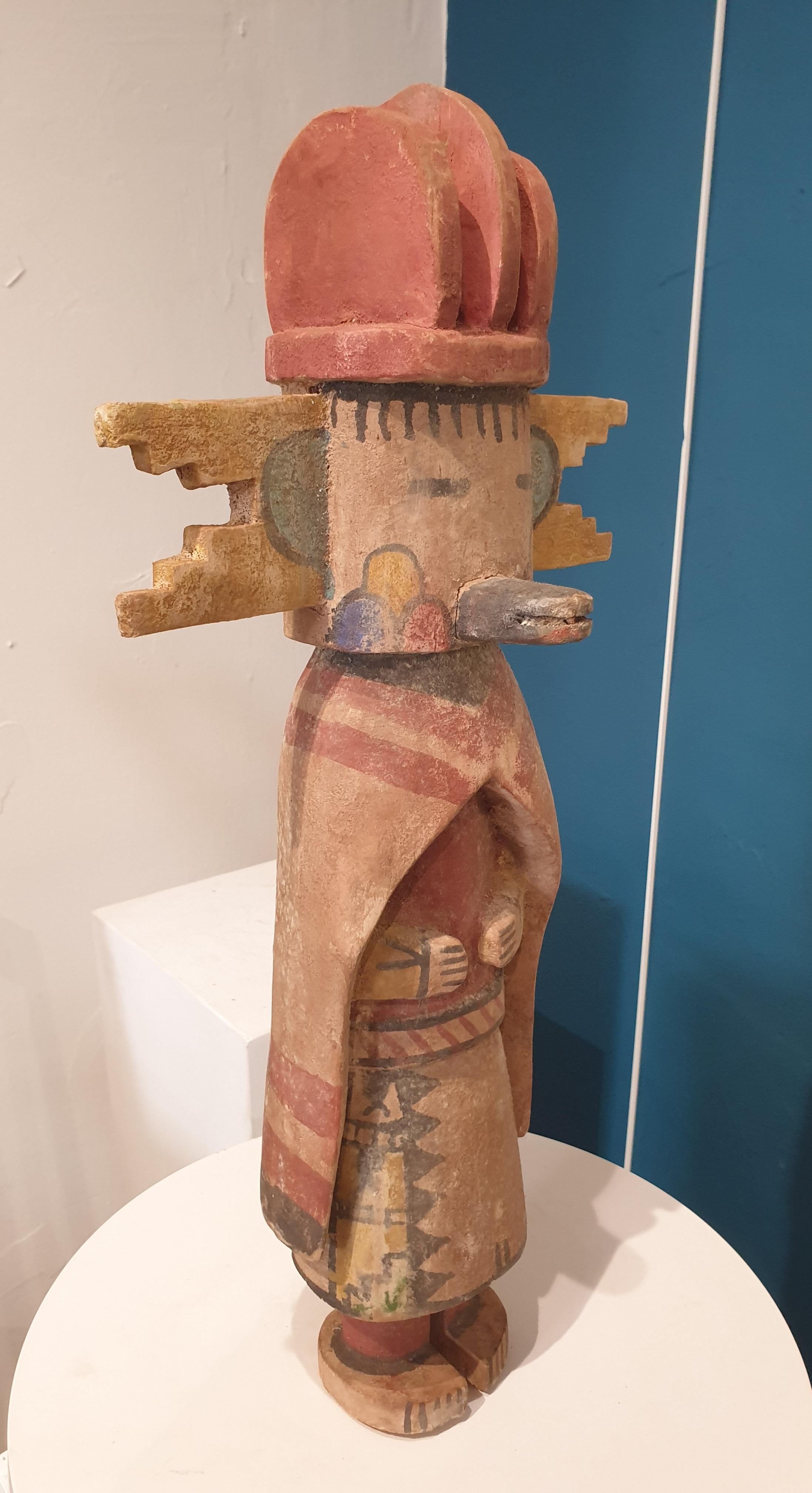Native North American carved wood and painted effigy figure, Hopi Katsina or Kachina doll.  This is one of a group of eight dolls all individually priced, or available as a set, and on 1stdibs.

Hopi Katsina dolls are wooden effigies of the Katsinam